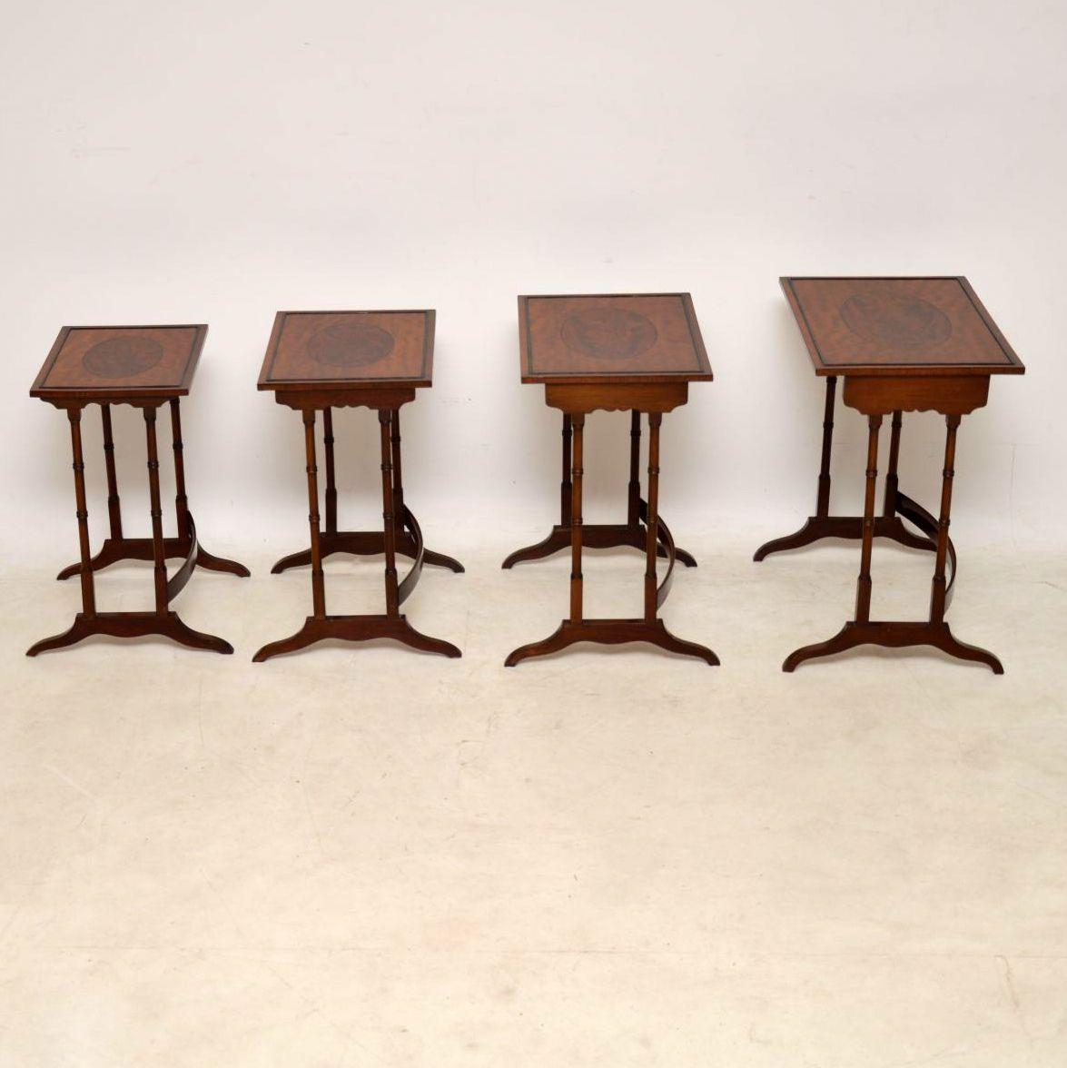 Antique Regency style nest of four tables in excellent condition dating to circa 1890-1910 period. They are beautifully made with lovely veneers, cross banding and inlays. I particularly like the flame mahogany oval panels in the middle of each