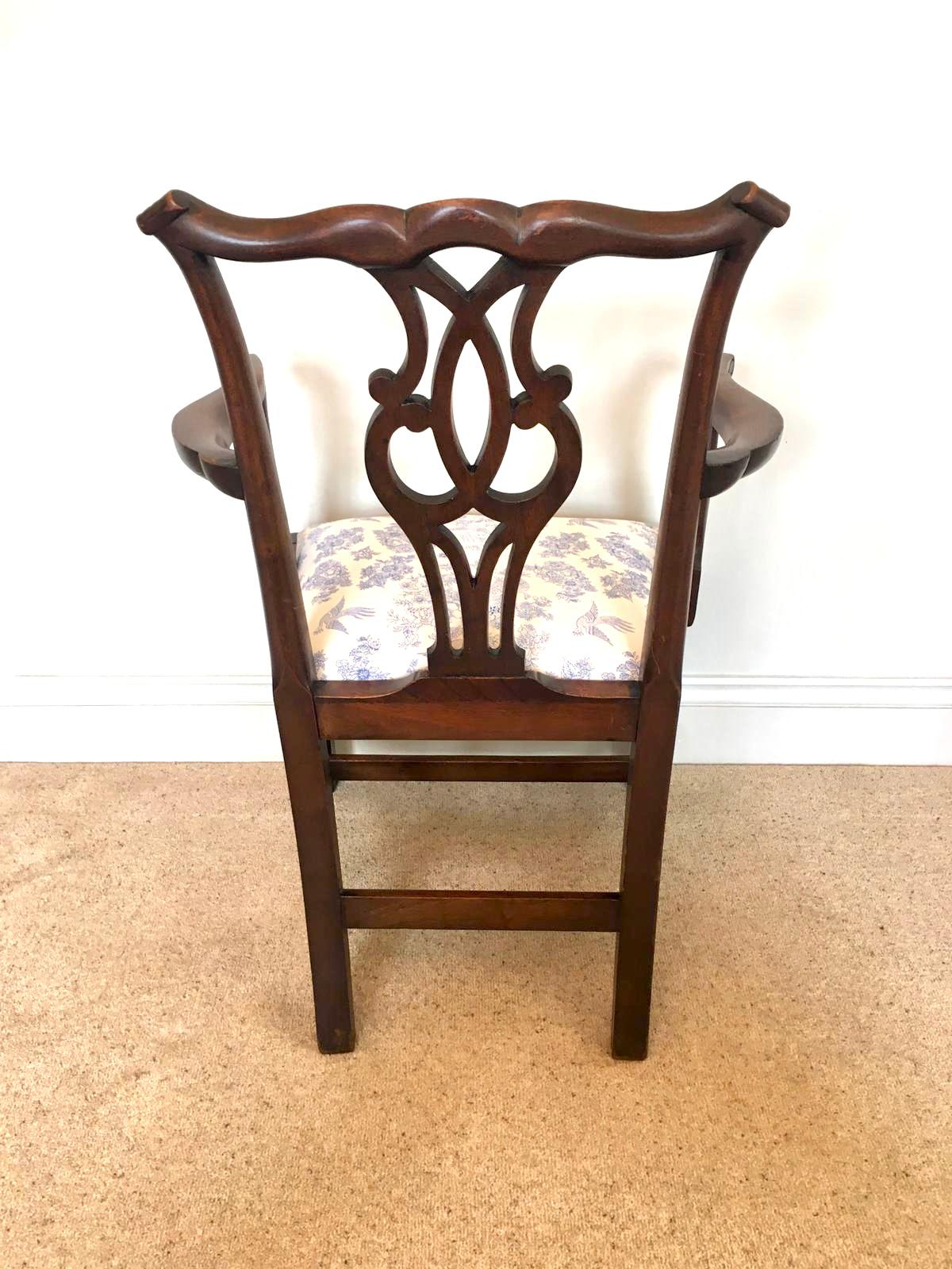 Antique mahogany open arm desk chair having an attractive shaped top rail and carved splat to the centre, shaped mahogany open arms with a newly reupholstered drop in seat in a quality fabric, mahogany frieze standing on square legs to the front and