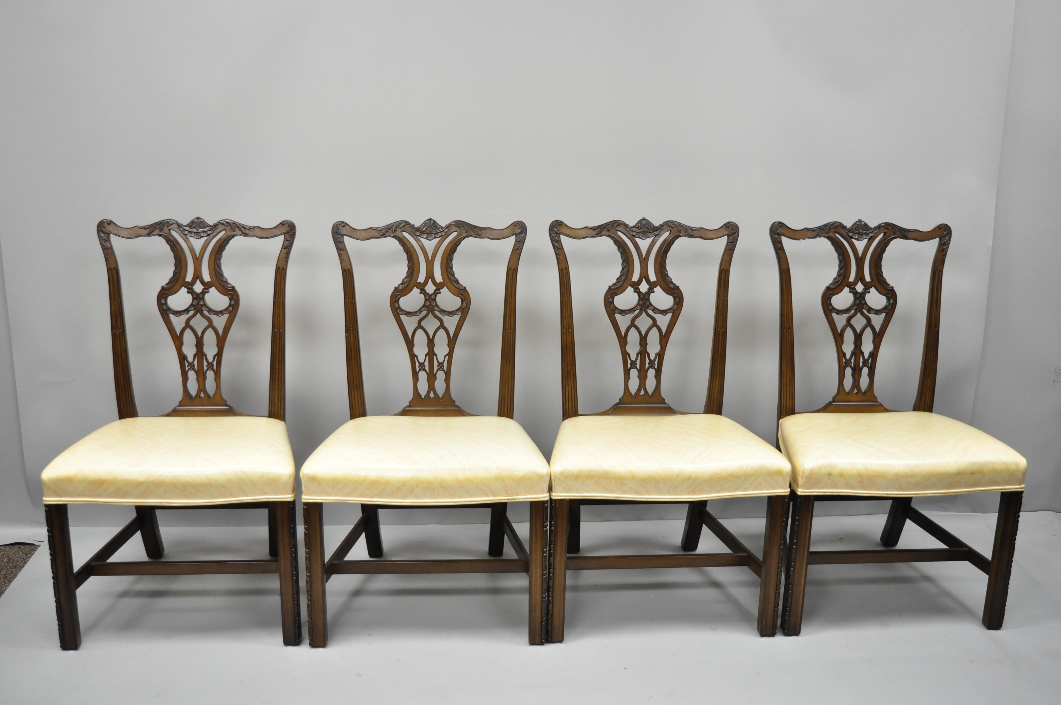 Set of 4 antique mahogany pagoda carved Chinese Chippendale style dining chairs. Listing includes pagoda carved top rail, vinyl upholstered seats, solid wood construction, beautiful wood grain, nicely carved details, great style and form, circa