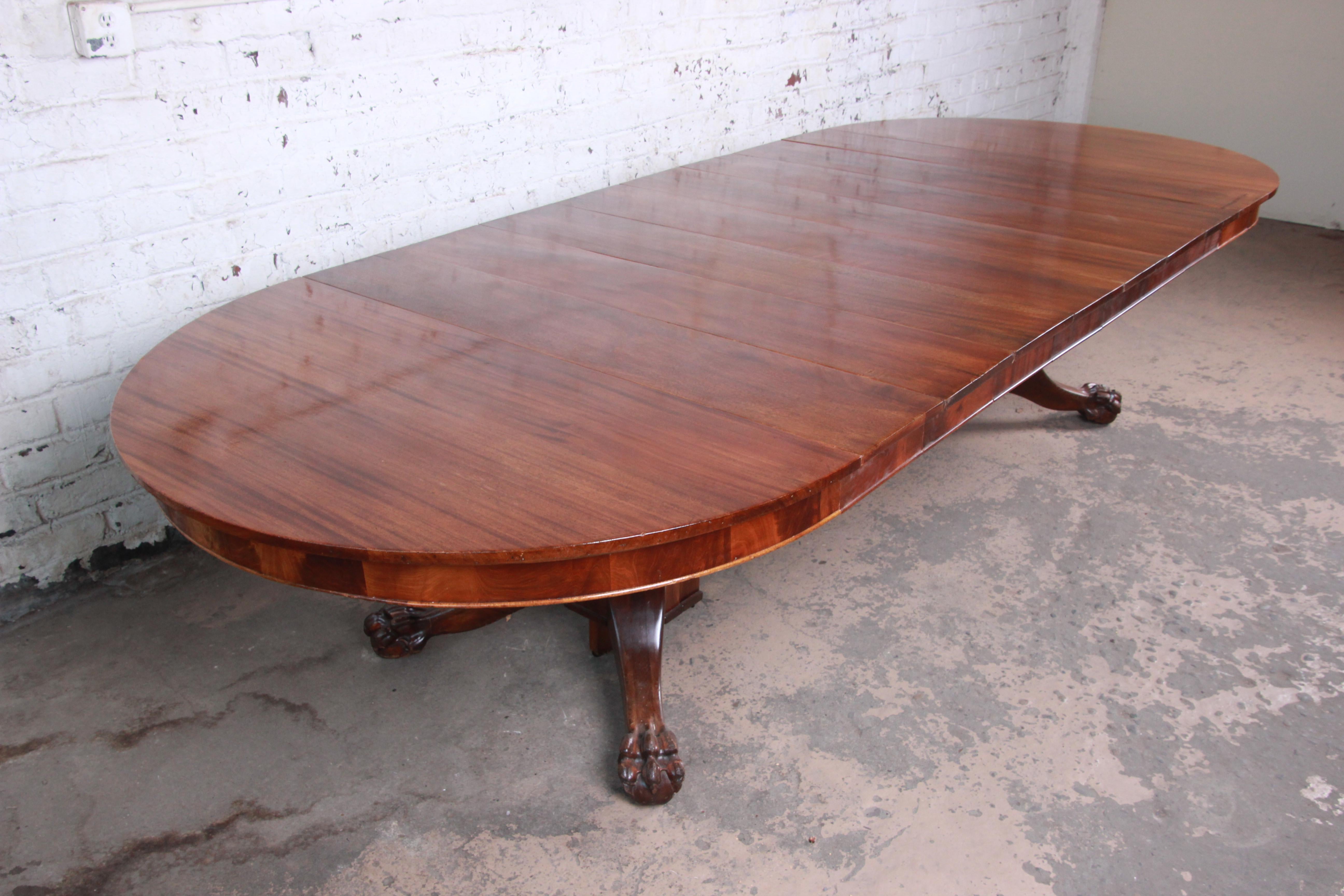 British Colonial Antique Mahogany Pawfoot Pedestal Extension Dining Table with Eight Leaves