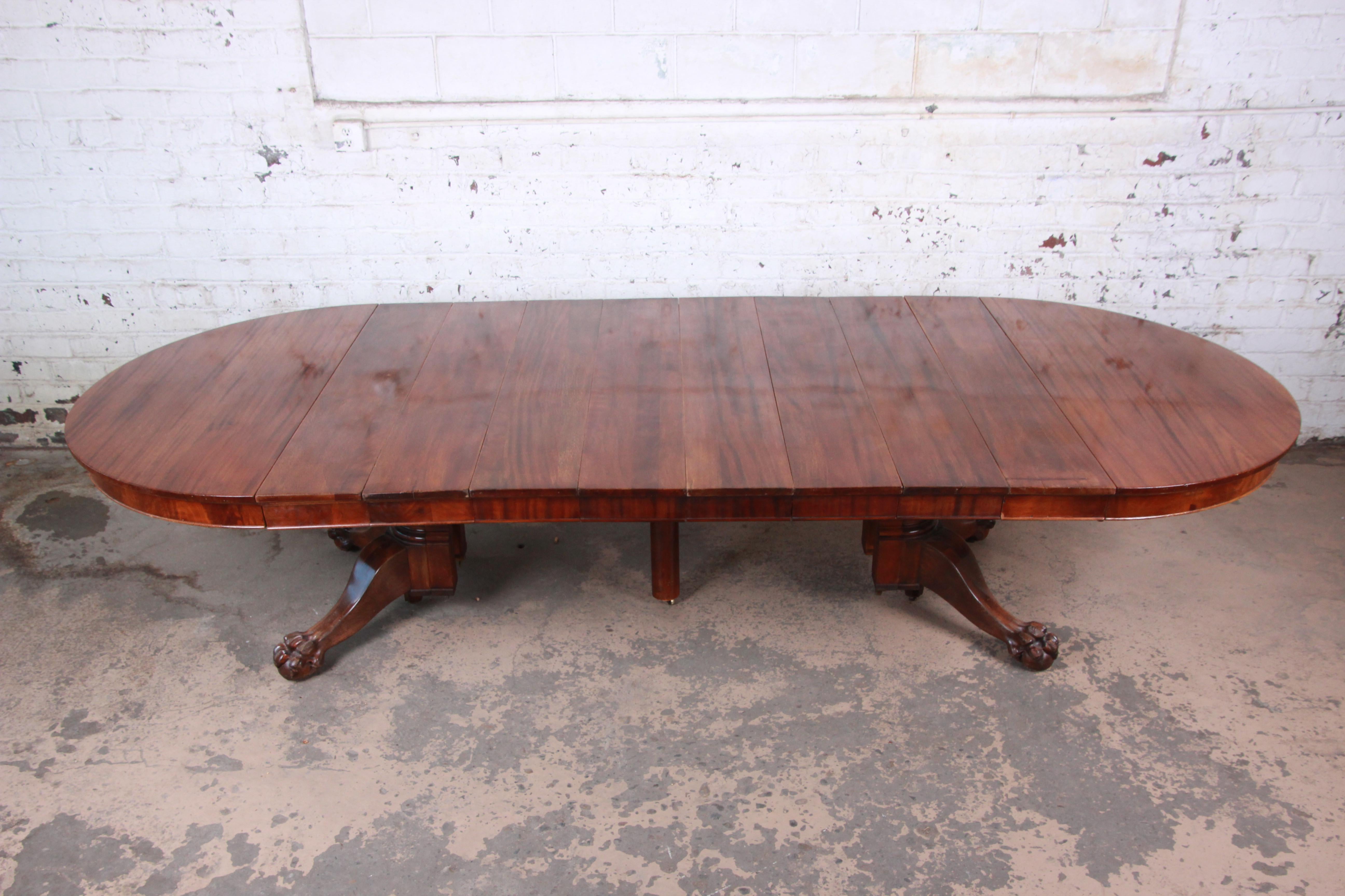 American Antique Mahogany Pawfoot Pedestal Extension Dining Table with Eight Leaves
