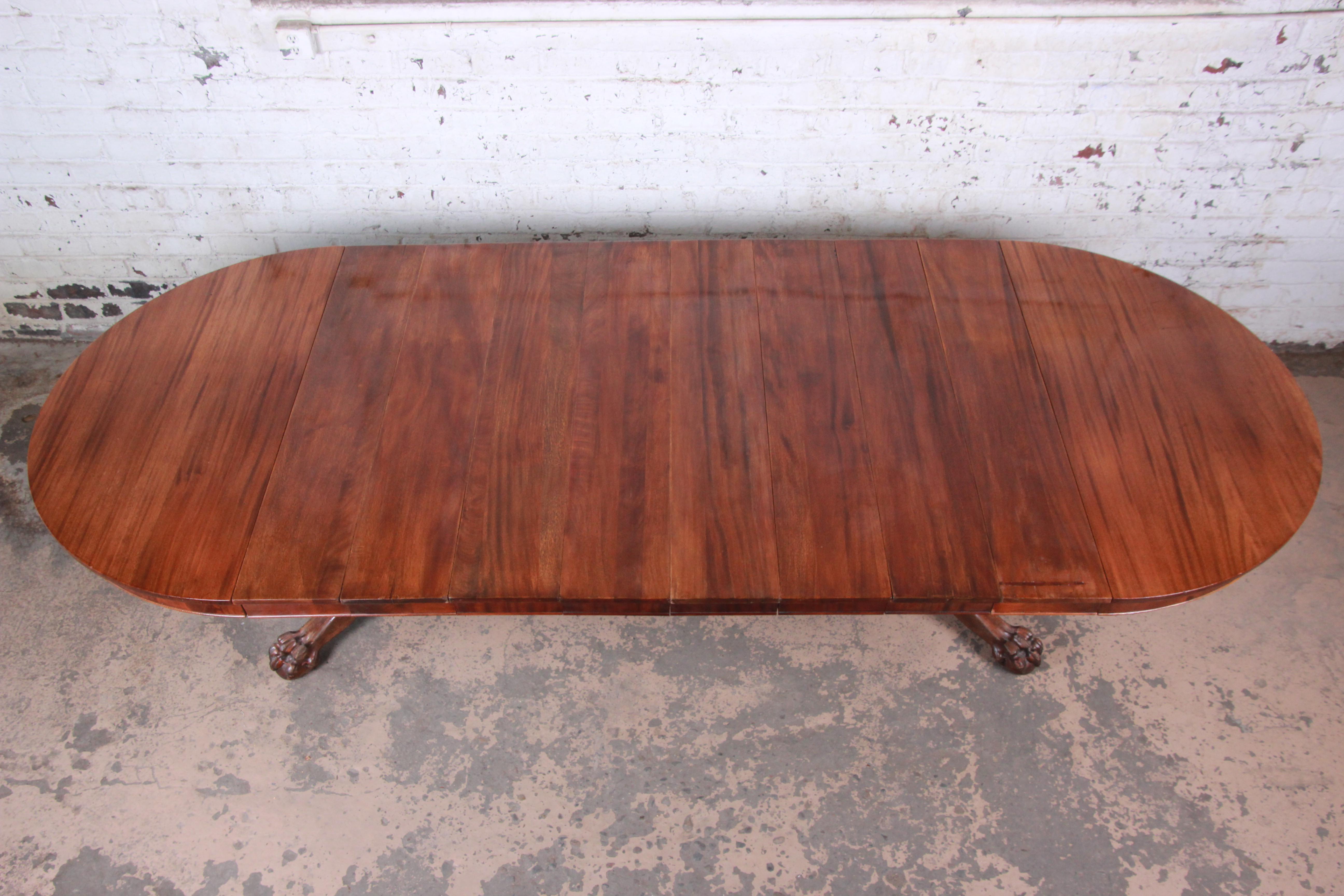 Antique Mahogany Pawfoot Pedestal Extension Dining Table with Eight Leaves In Good Condition In South Bend, IN