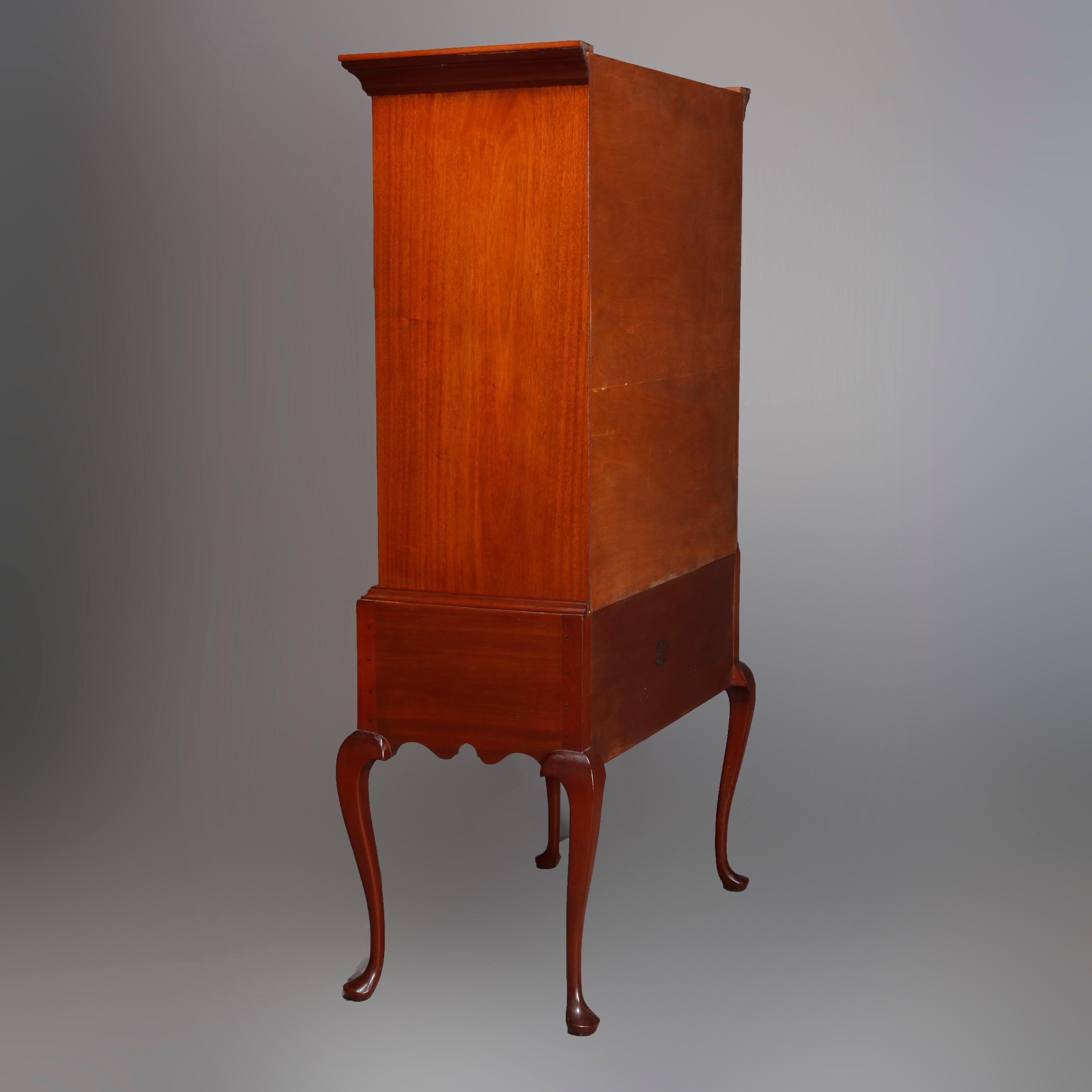 An antique Queen Anne style tall chest on chest by Copenhaver's Furniture, Winchester, VA offers mahogany construction with upper case having smaller drawers over long drawers and seated on base with drawers, shaped skirt, raised on cabriole legs