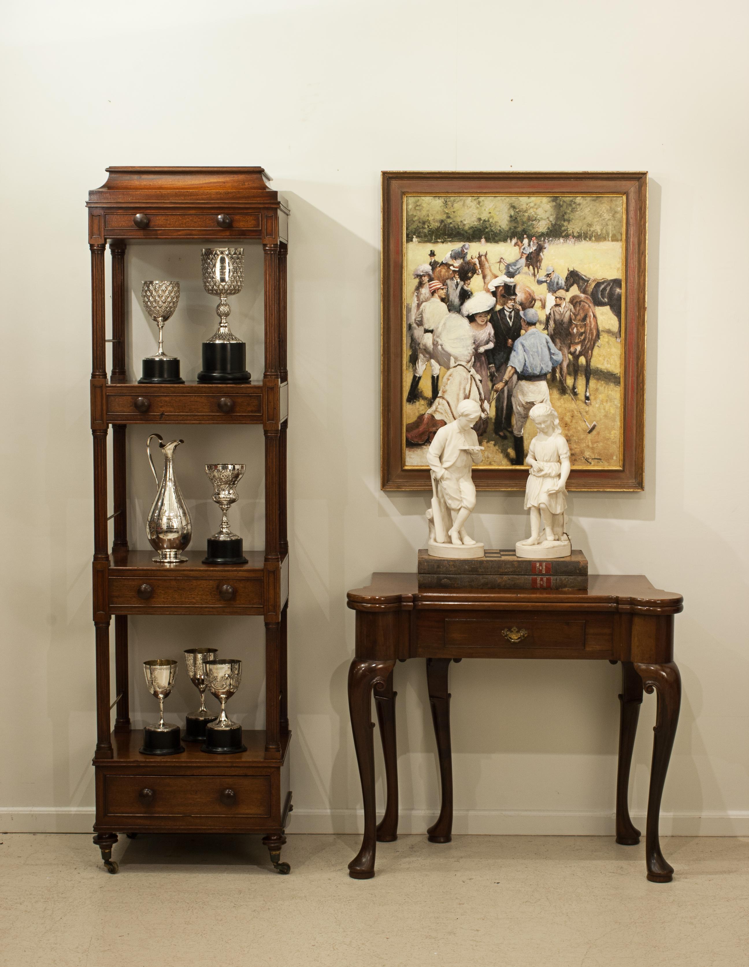 Antique Mahogany Regency Etagere, What Not.
A very nice and unusual three tier Étagère with drawers. The good usable three tier what-not is free standing, constructed from mahogany, with four graduating drawers and raised on four brass cup castors.