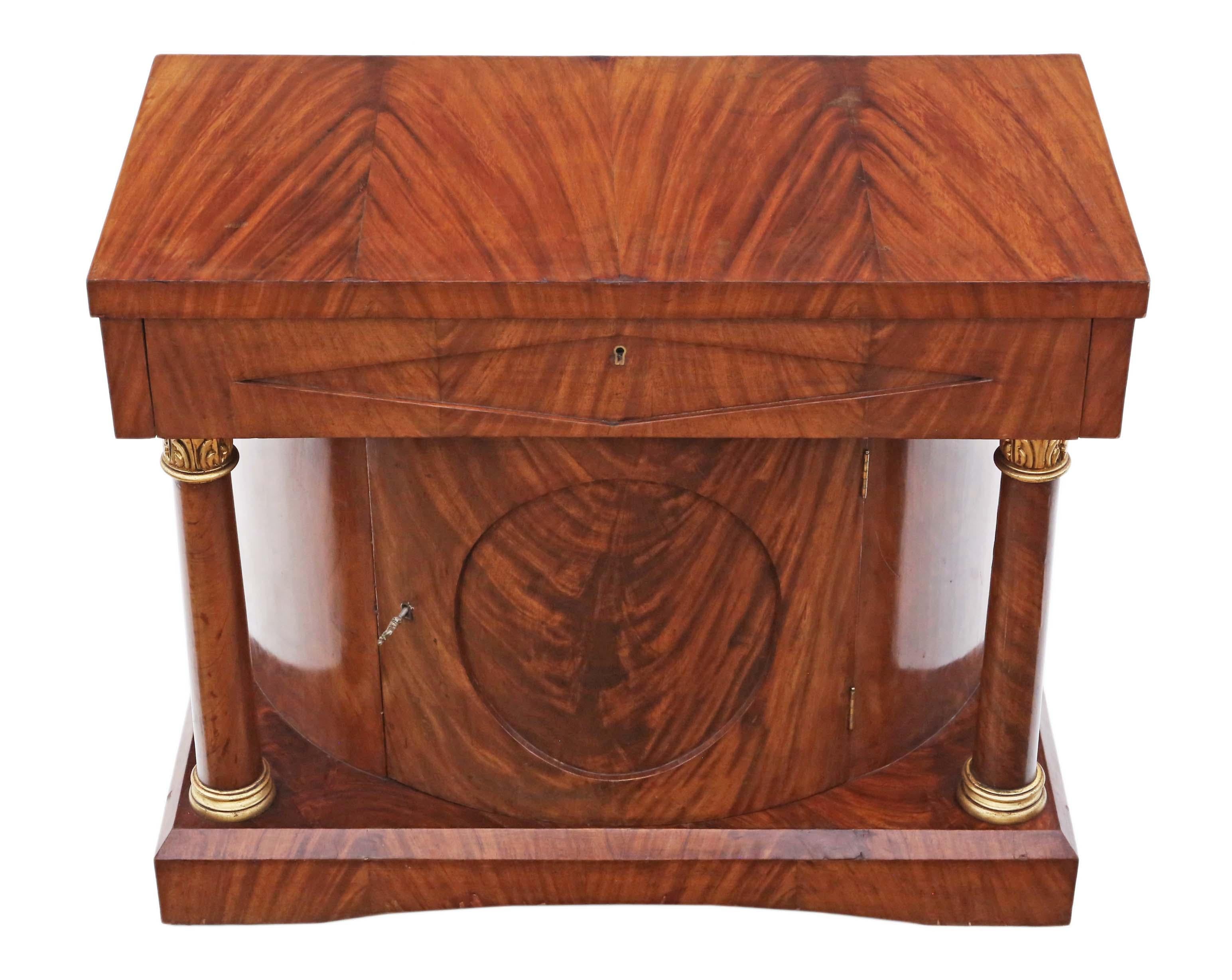 Antique quality mahogany Regency revival console cupboard table C1920.

No loose joints. A rare decorative find with attractive gilt mahogany pilasters. Key for cupboard door only.

Would look great in the right location!

The oak lined drawer