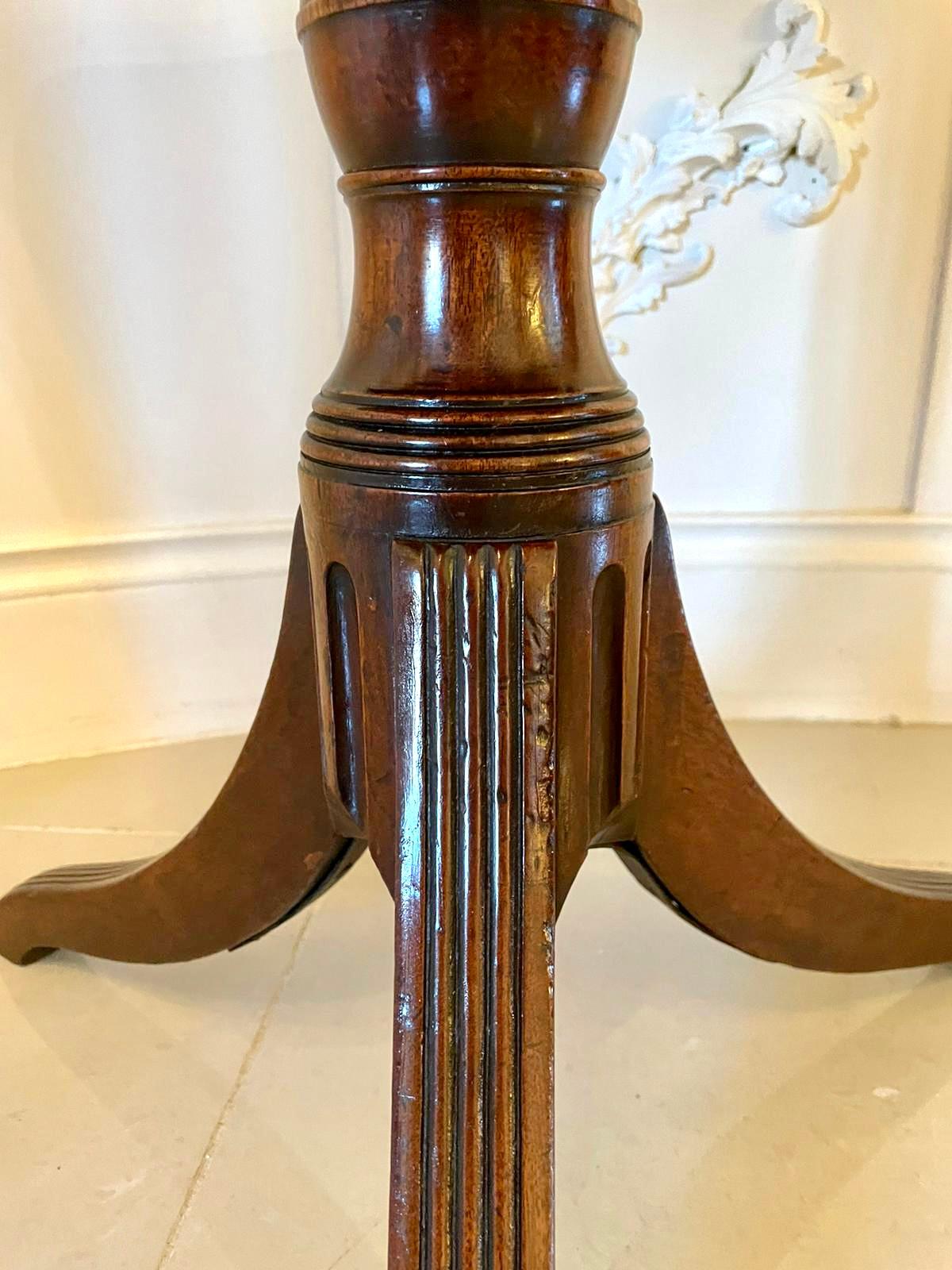 Antique mahogany Regency tripod table having a quality mahogany tilting top with a reeded edge supported by a shaped turned column standing on shaped spaded legs.

A splendid example having a wonderful colour and patina and in original