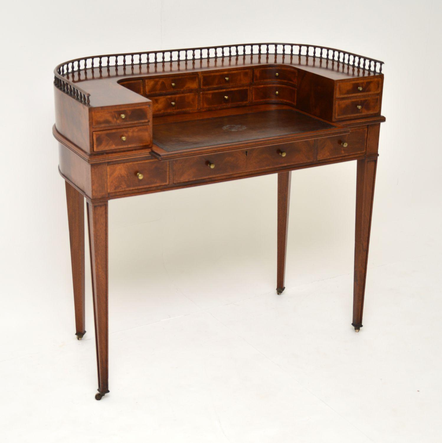 A beautiful and quite petite antique Carlton House desk in mahogany with an intricately tooled leather writing surface. This dates from circa late 19th century, probably 1890s-1900s.

It is an unusual size and of really high quality, with
