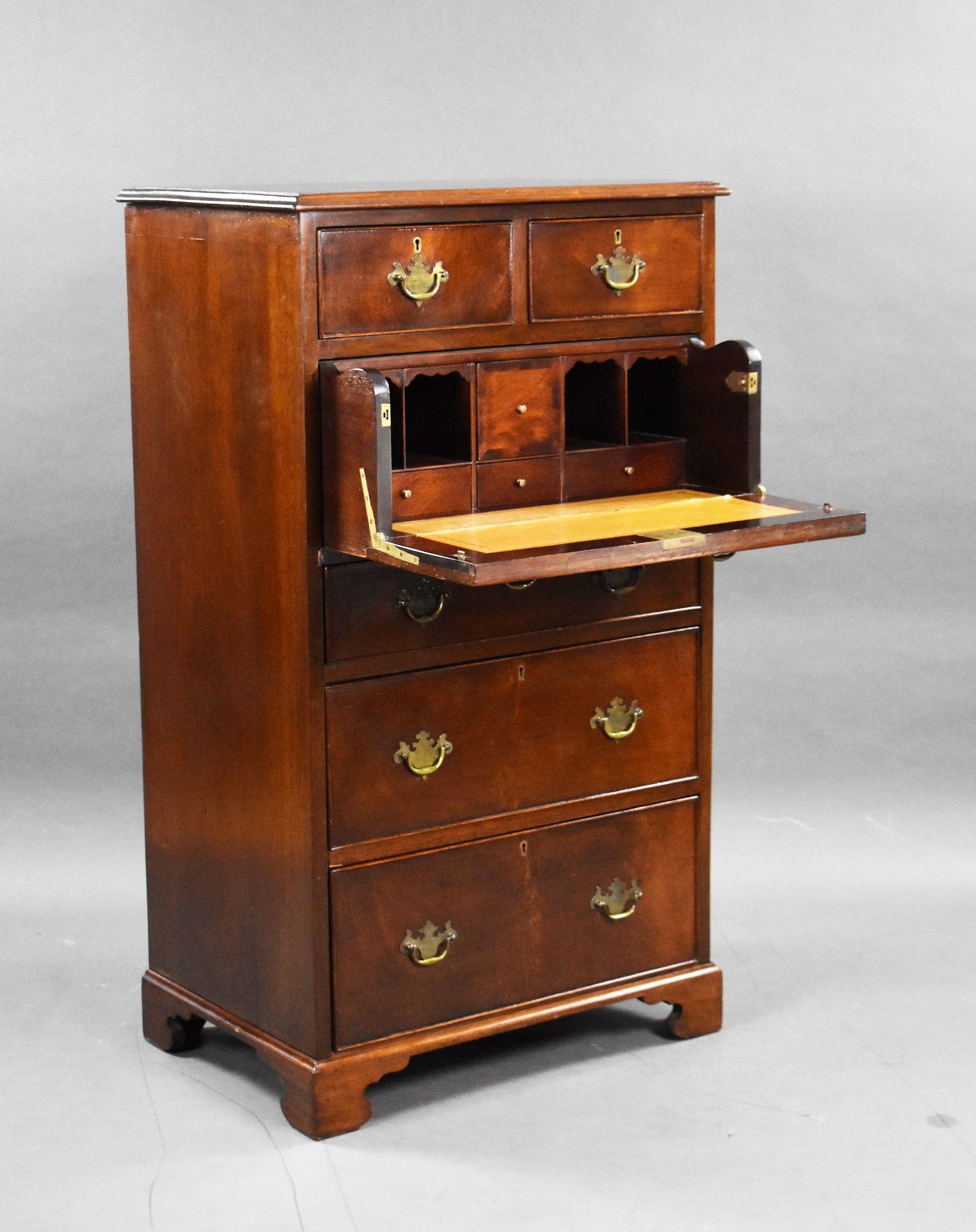 Antique Mahogany Secretaire Chest, Circa 1930
Item Code: LC1260
This elegant circa 1930 mahogany secretaire chest combines refined Georgian-inspired charm with practical storage and workspace functionality. The upper section features two short