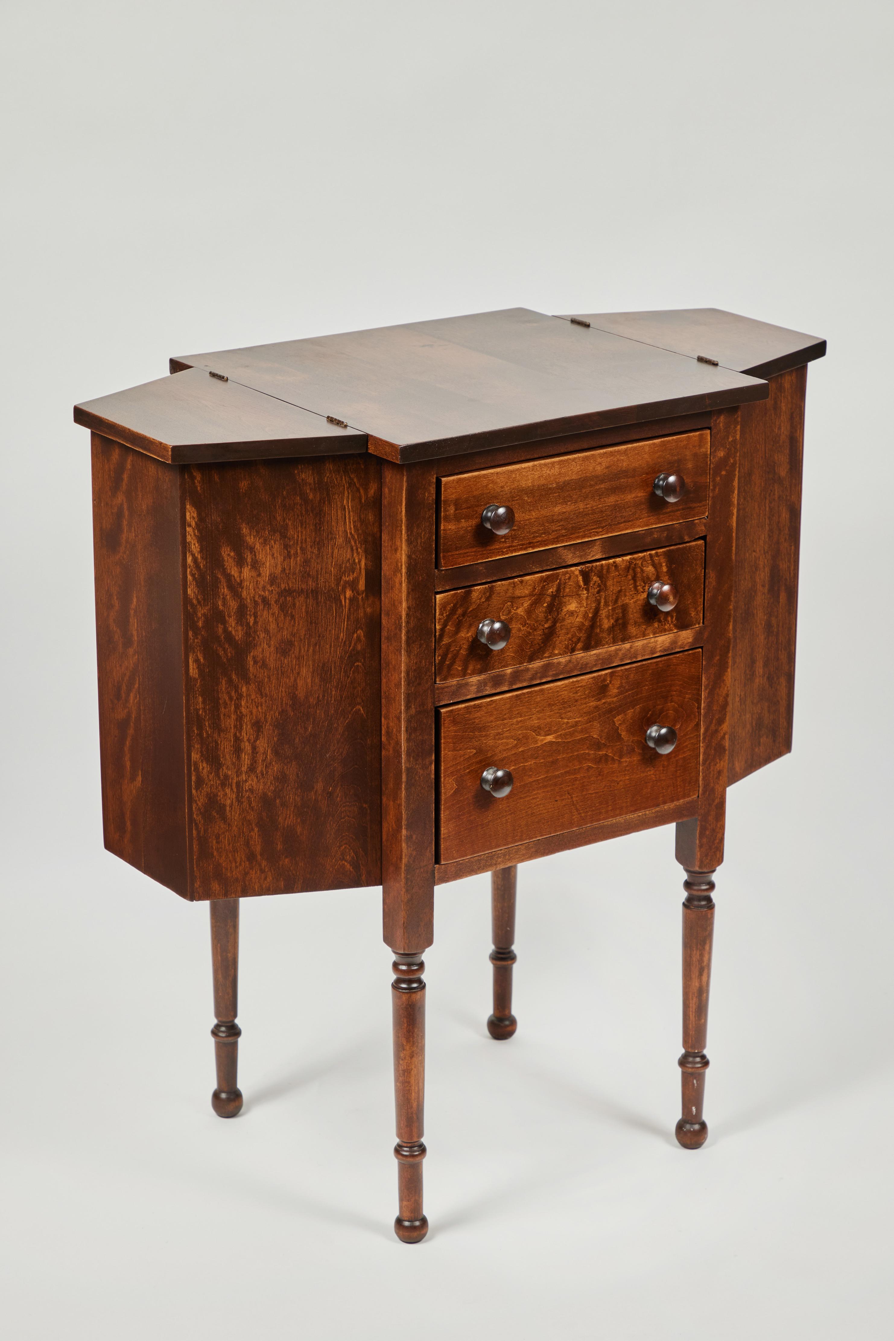 Antique mahogany sewing cabinet w/ 3 drawers + 2 side storage compartments, newly refinished.