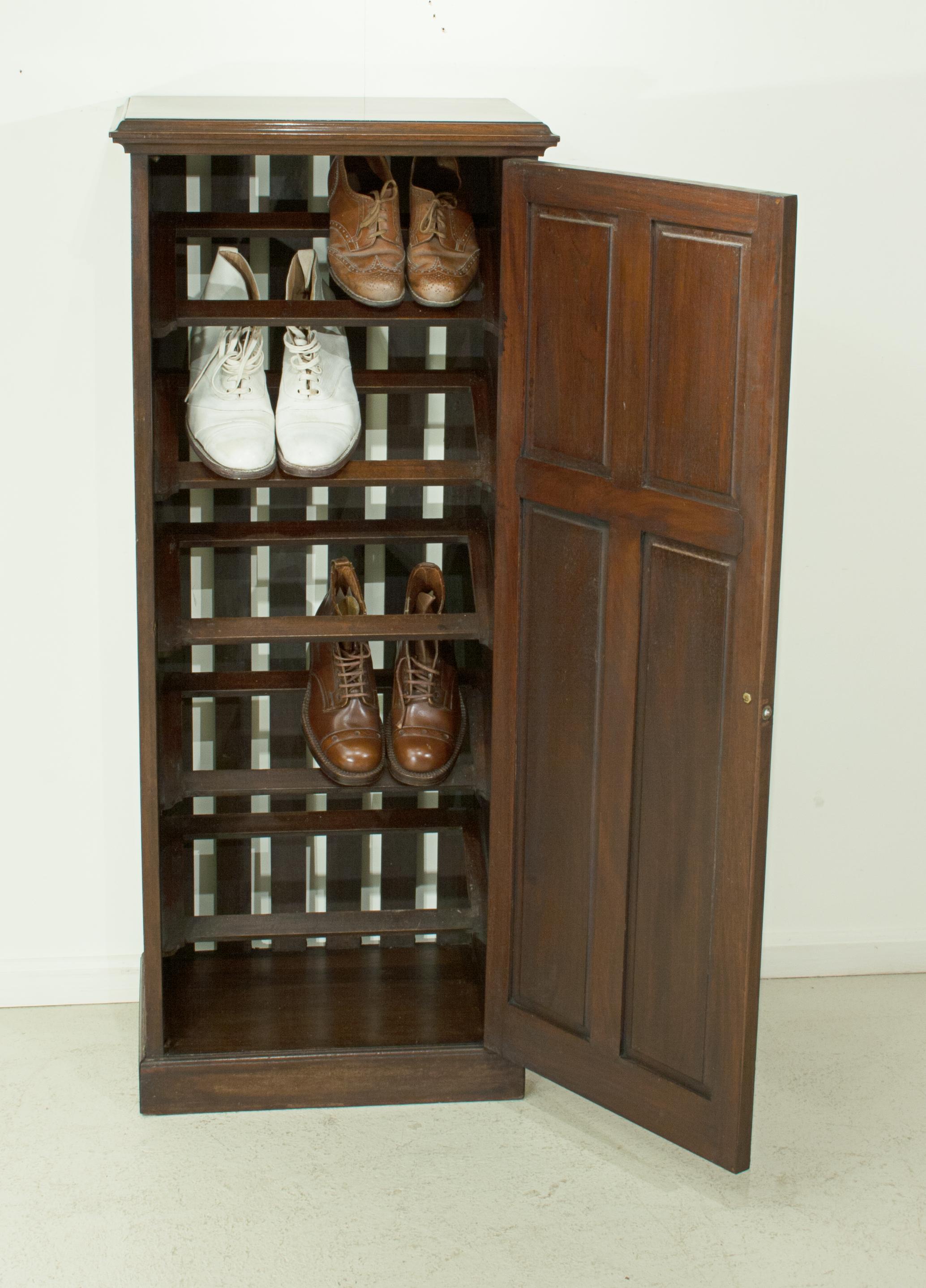 Mahogany shoe cupboard.
A tall slender mahogany cupboard for the sole purpose of shoe storage. This shoe cabinet will tidy up the hall way or bedroom and stop those shoes from cluttering the floor. Crafted from solid mahogany with a four panelled