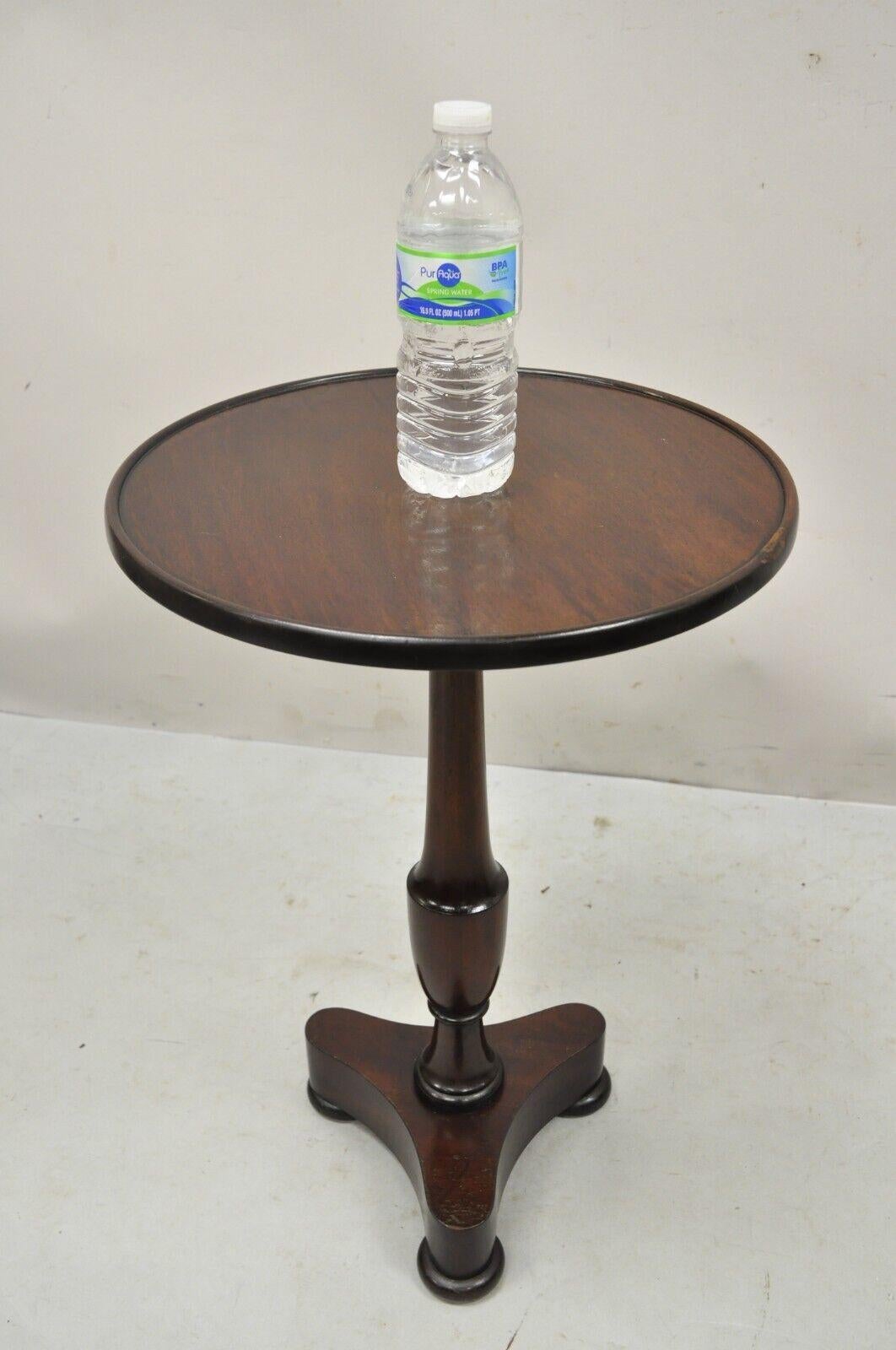 Antique mahogany Small Empire Pedestal Base Round accent side table. Item features a solid mahogany pedestal base, round top, nice small size, very nice antique item, quality craftsmanship. Circa Early 1900s. Measurements: 22.5