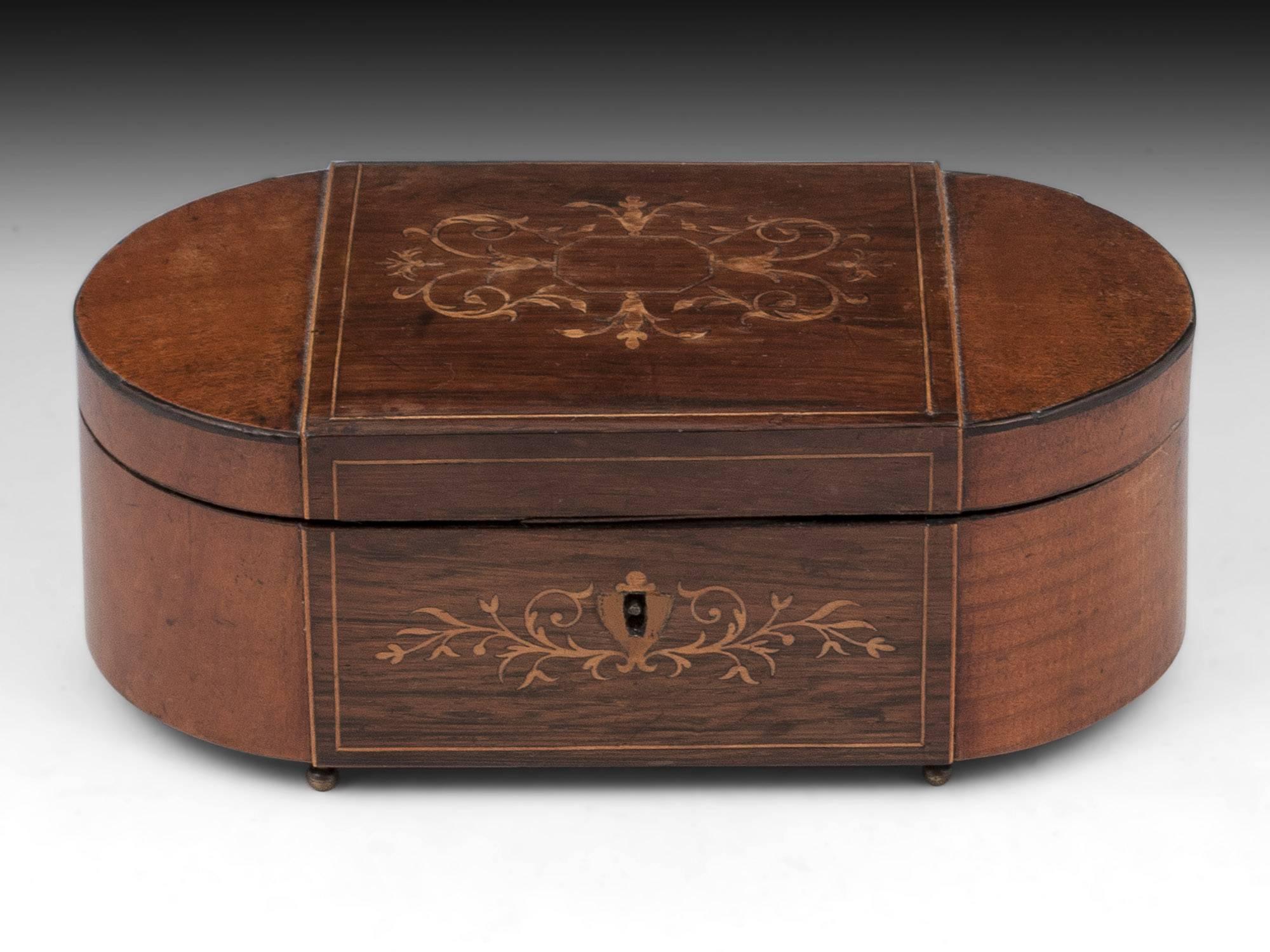 Antique Palais Royal sewing box veneered in mahogany and sycamore with boxwood stringing and floral inlays, standing on four small ball feet. 

Opening the palais royal box reveals its original mirror backed lid, framed with decorative rope. The