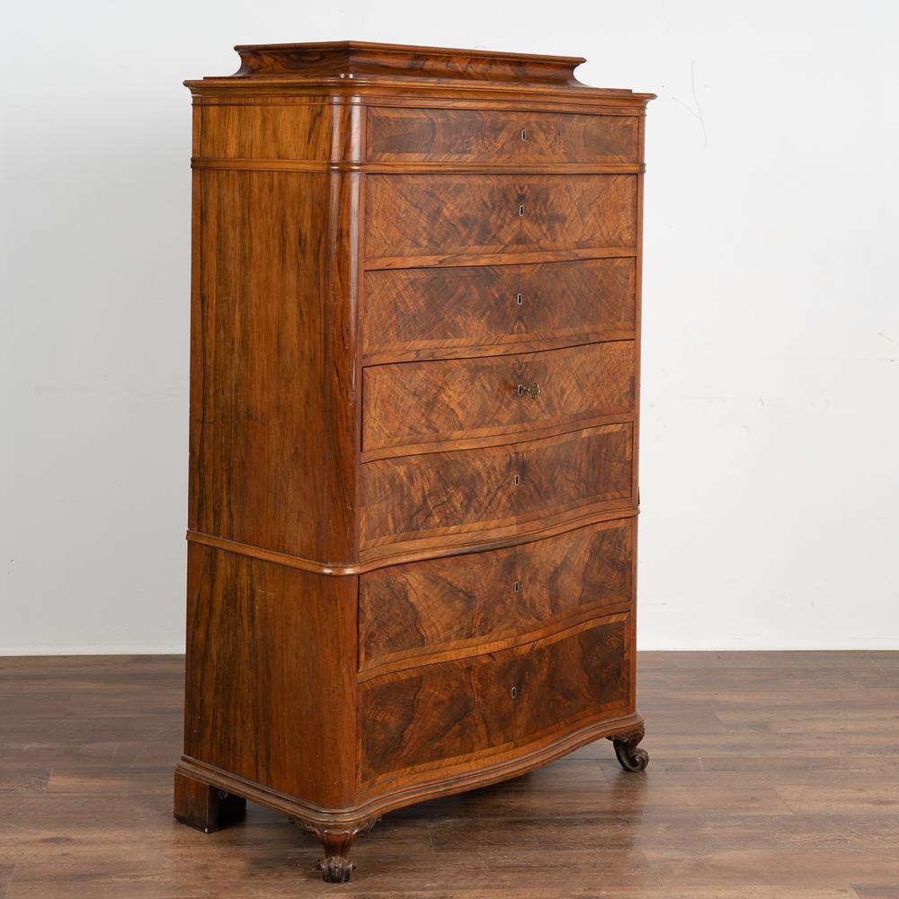 The mahogany veneer is stunning in this classic tall chest of 7 drawers.
The highboy is built in 2 sections making it easier to move/install and rests on carved feet.
This handsome mahogany highboy has been professionally restored and is ready to