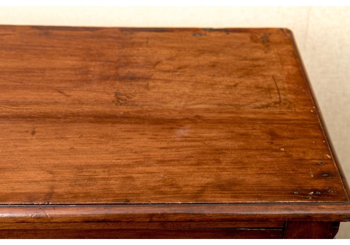 Antique mahogany three drawer chest having peg drawer construction with brass batwing drawer pulls and escutcheons, planked back and the whole resting on bracket feet.

Dimensions: 30 1/2