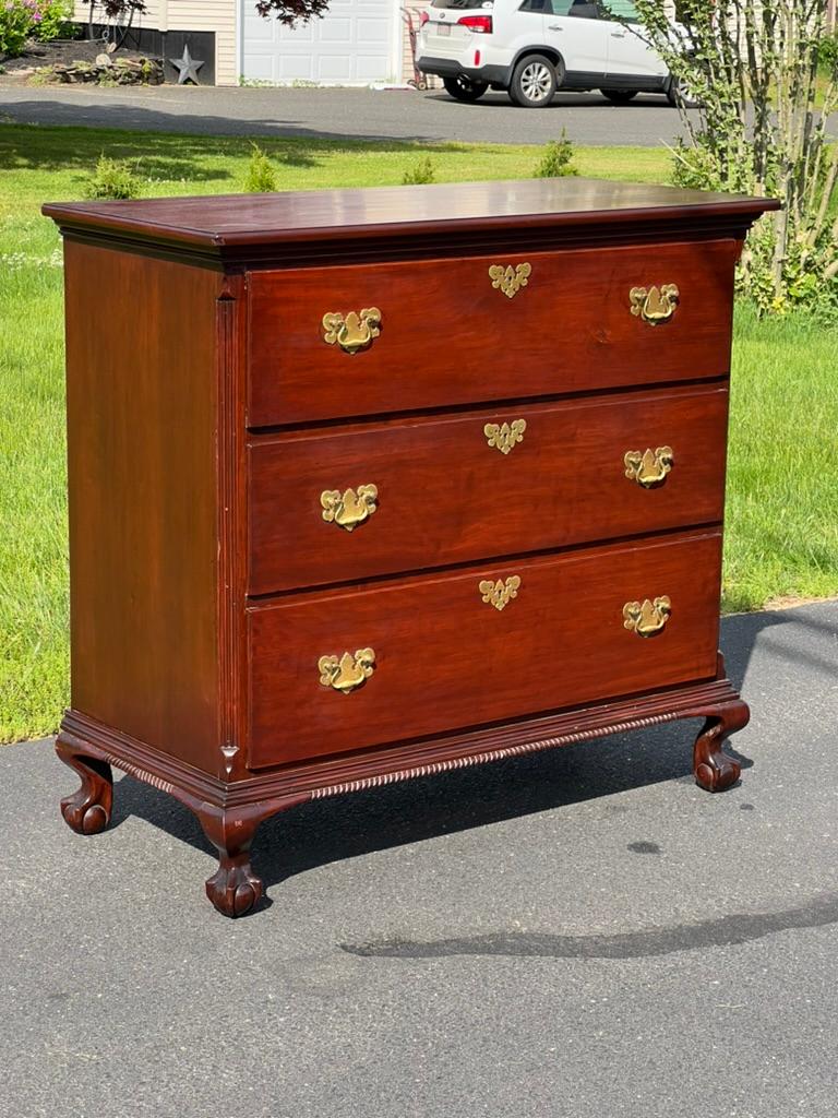 Introducing an exquisite Antique Mahogany Three Drawer Chippendale Chest, dating back to circa 1820. This elegant piece is a fine example of Chippendale craftsmanship, showcasing the timeless beauty and sophistication characteristic of the early
