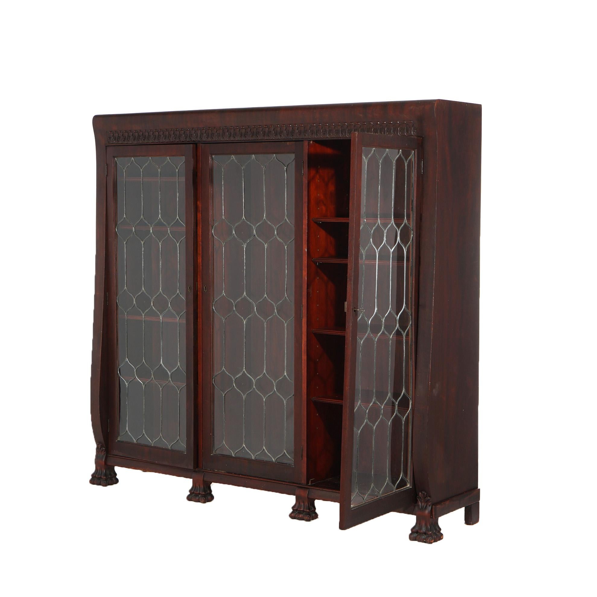 American Empire Antique Mahogany Triple Door Leaded Glass Bookcase with Carved Claw Feet C1900 For Sale