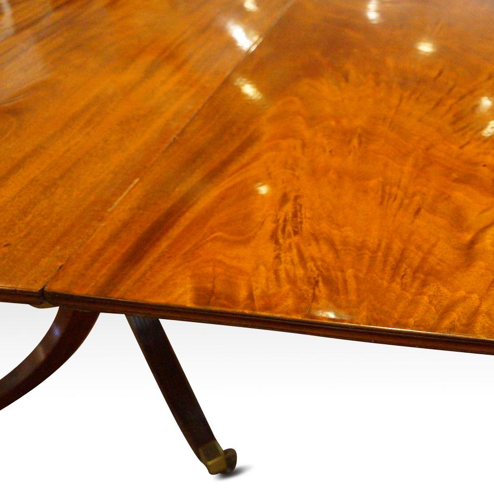 Antique mahogany twin pillar dining table
This antique mahogany twin pillar dining table was first made in the early 19th century.
The dining room table closes to a round.
It has 2 leaves that can be placed in to extend to give you more dining