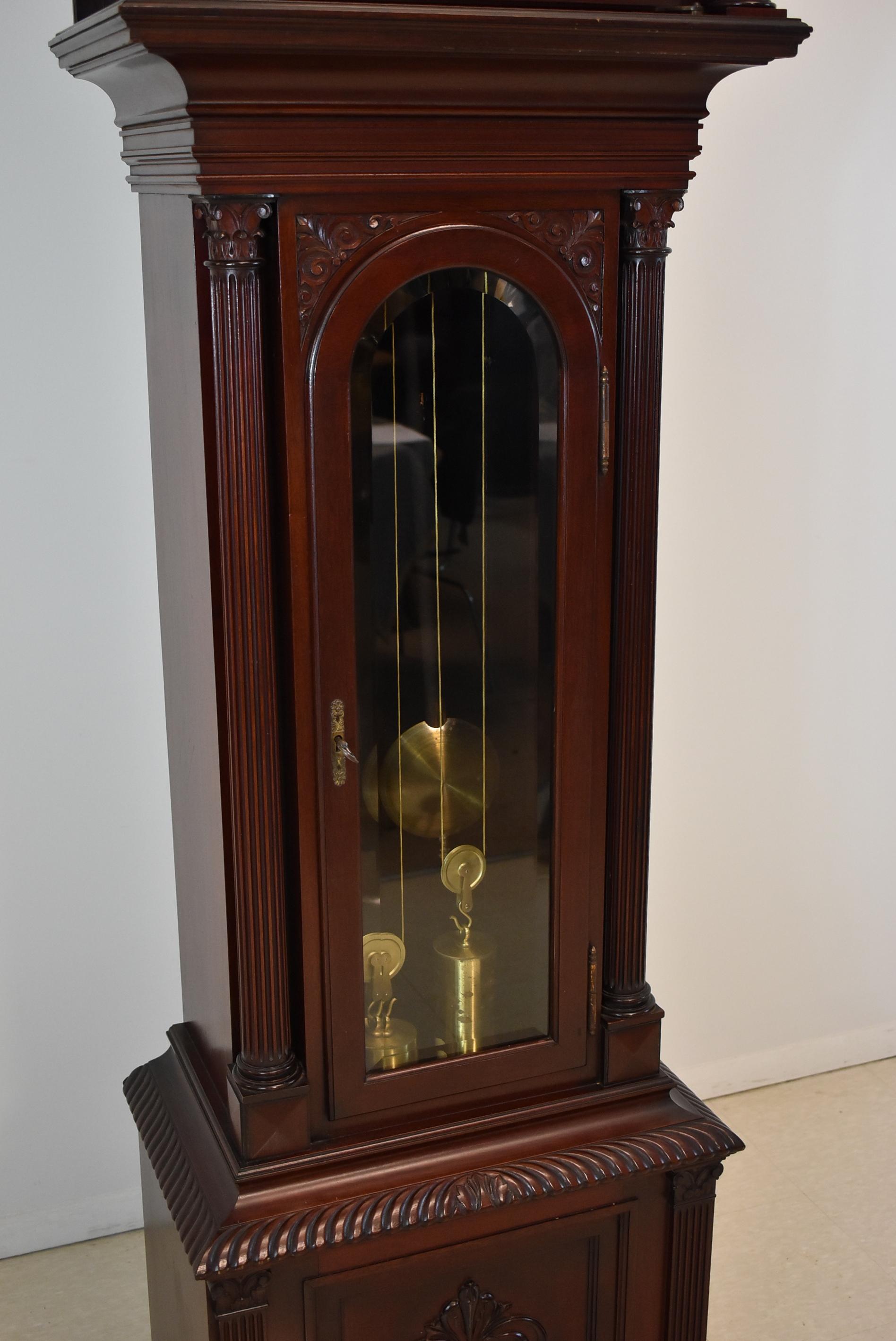 Antique mahogany Webb C Ball grandfather clock Cleveland Ohio, circa 1900. Movement stamped Chas. Korfhage New York numbered 188. Moon phase, nice dial with minor wear. Case has fluted pillars and Corinthian tops in original finish. Decorative claw