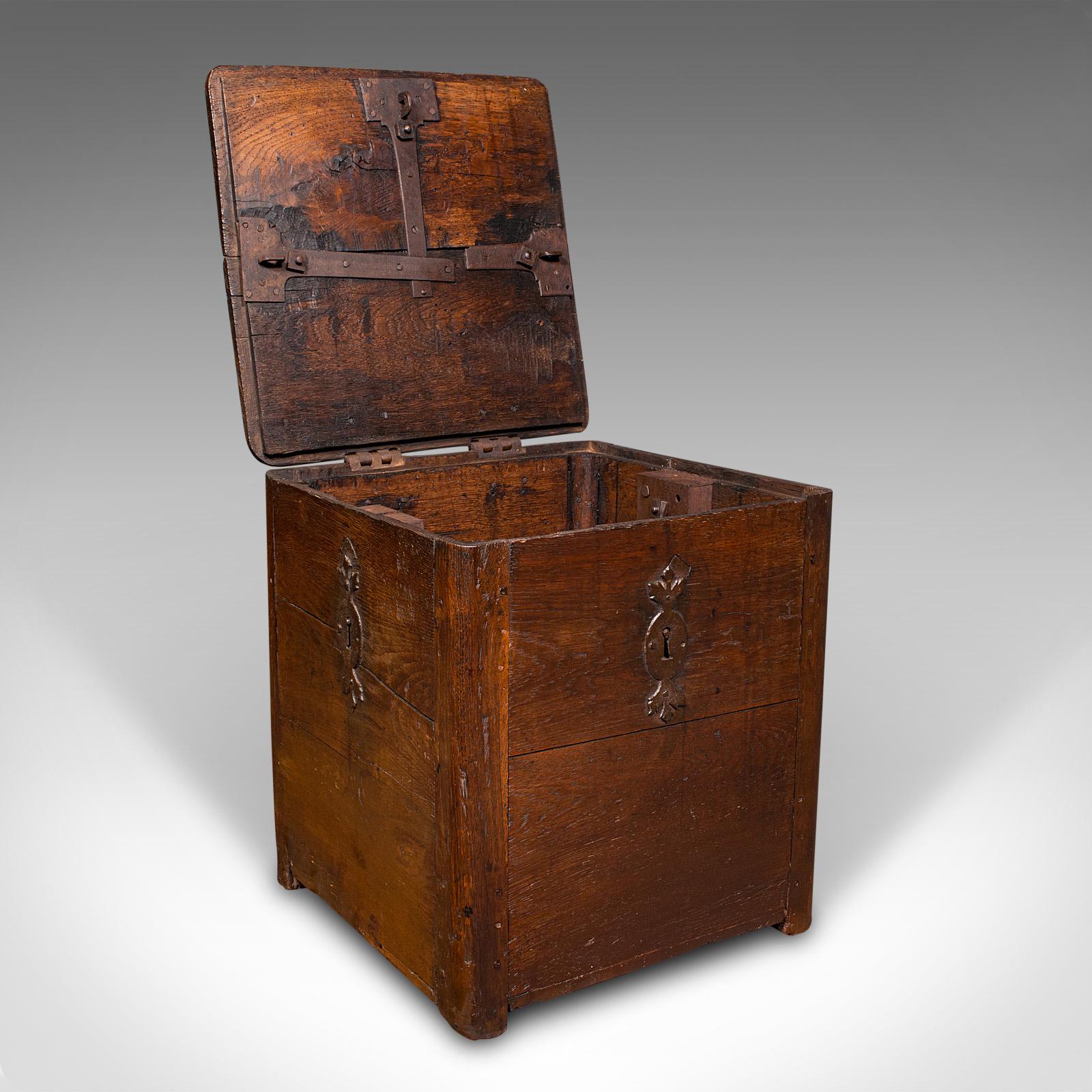This is an antique mail carriage strong box. An English, oak security chest, dating to the early Georgian period, circa 1720.

Fascinating George I lock box from the time of the highwayman
Displays a desirable aged patina throughout
Wonderfully aged
