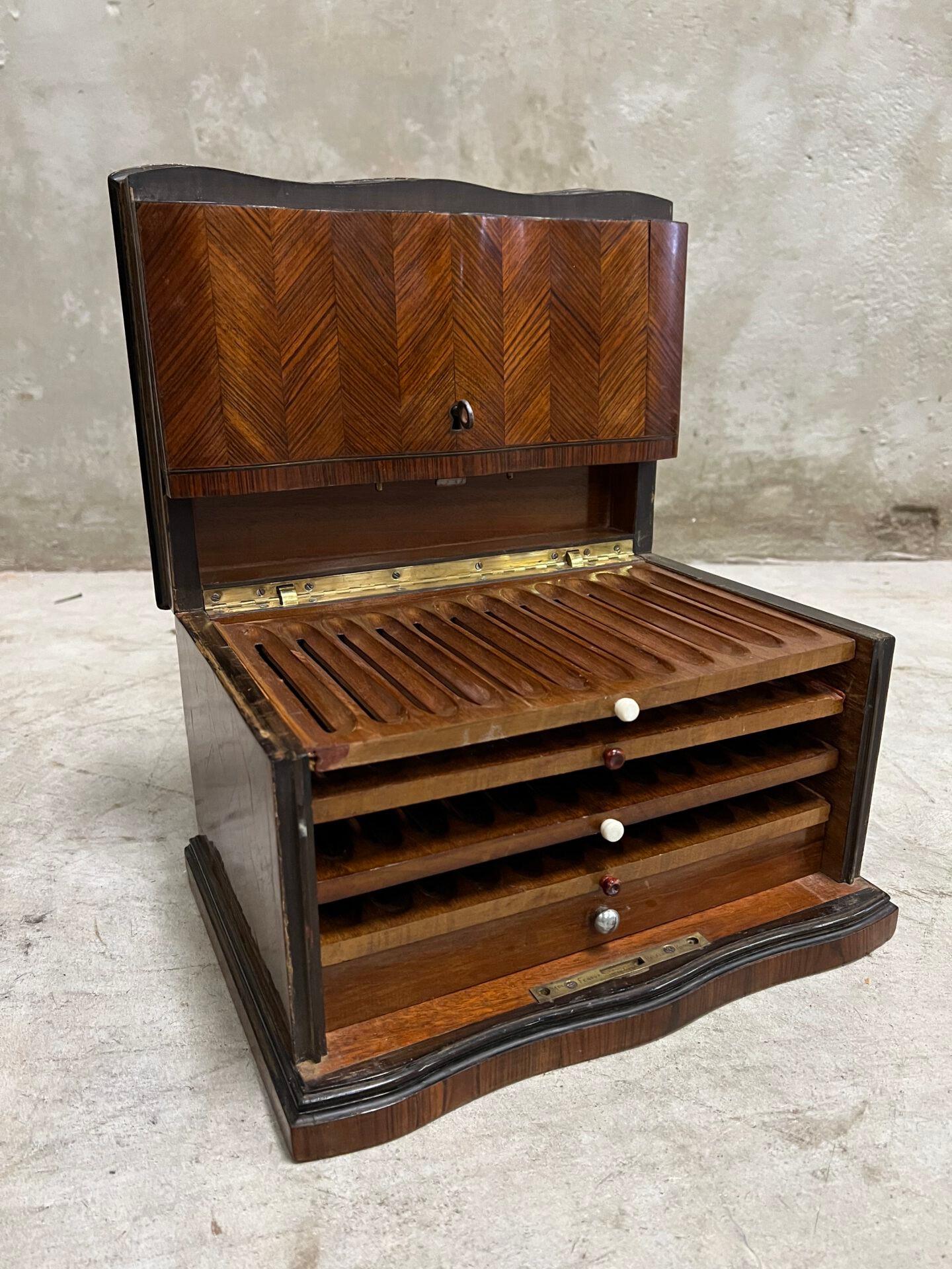 For the cigar smoker! This French Napoleon III cigar box / cabinet is an addition to your office or home. Dating from the period around 1850-1870 and is inlaid with brass, mother-of-pearl on the top. Entirely patterned with wood. Super chic and