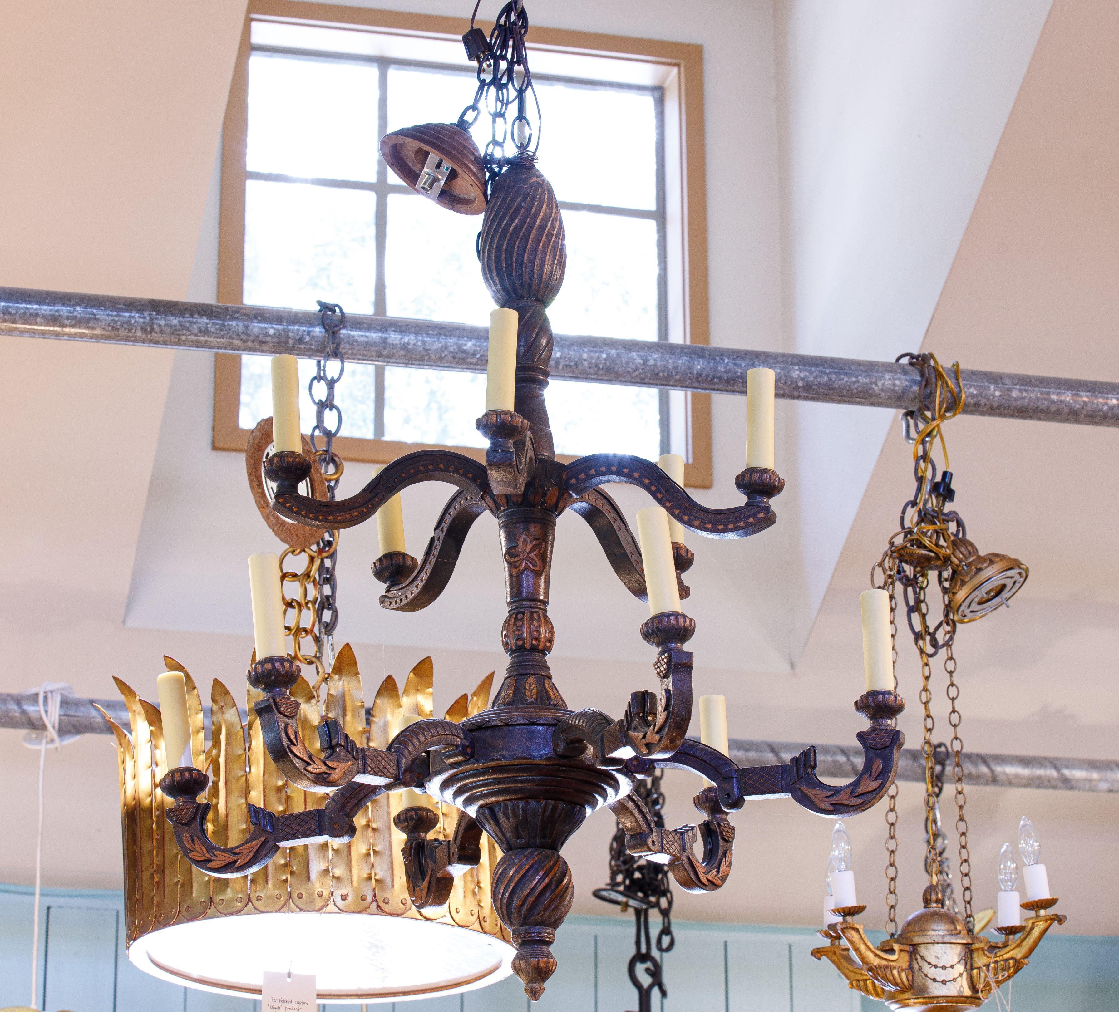 This antique carved light has an unusual and rare design. It has an Arts and Crafts style and two levels that result in an impressive appearance. It is simpler than Black Forest and was not made in Germany, but might look interesting in a place that