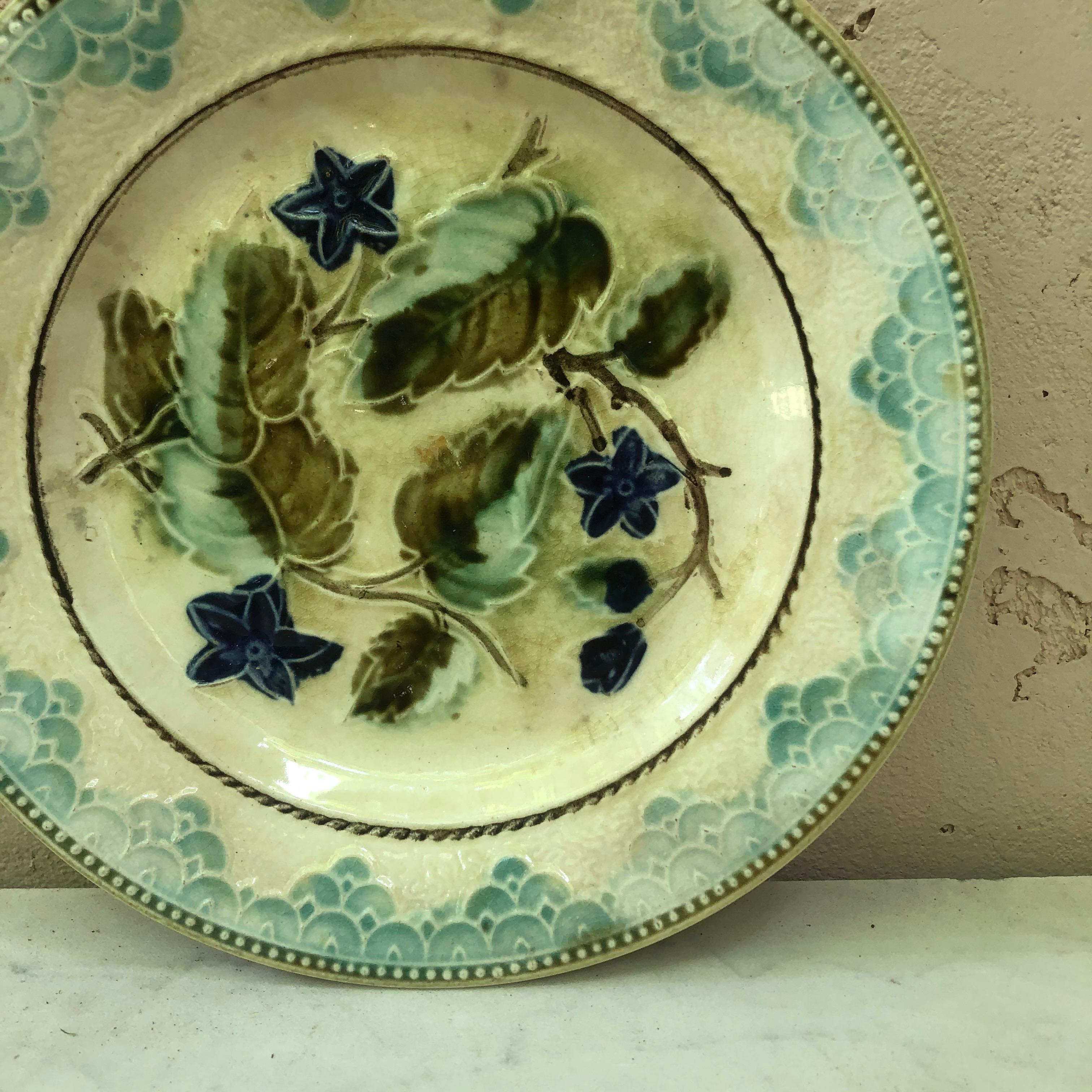 Majolica plate with blue flowers and leaves, circa 1890 attributed to Onnaing.