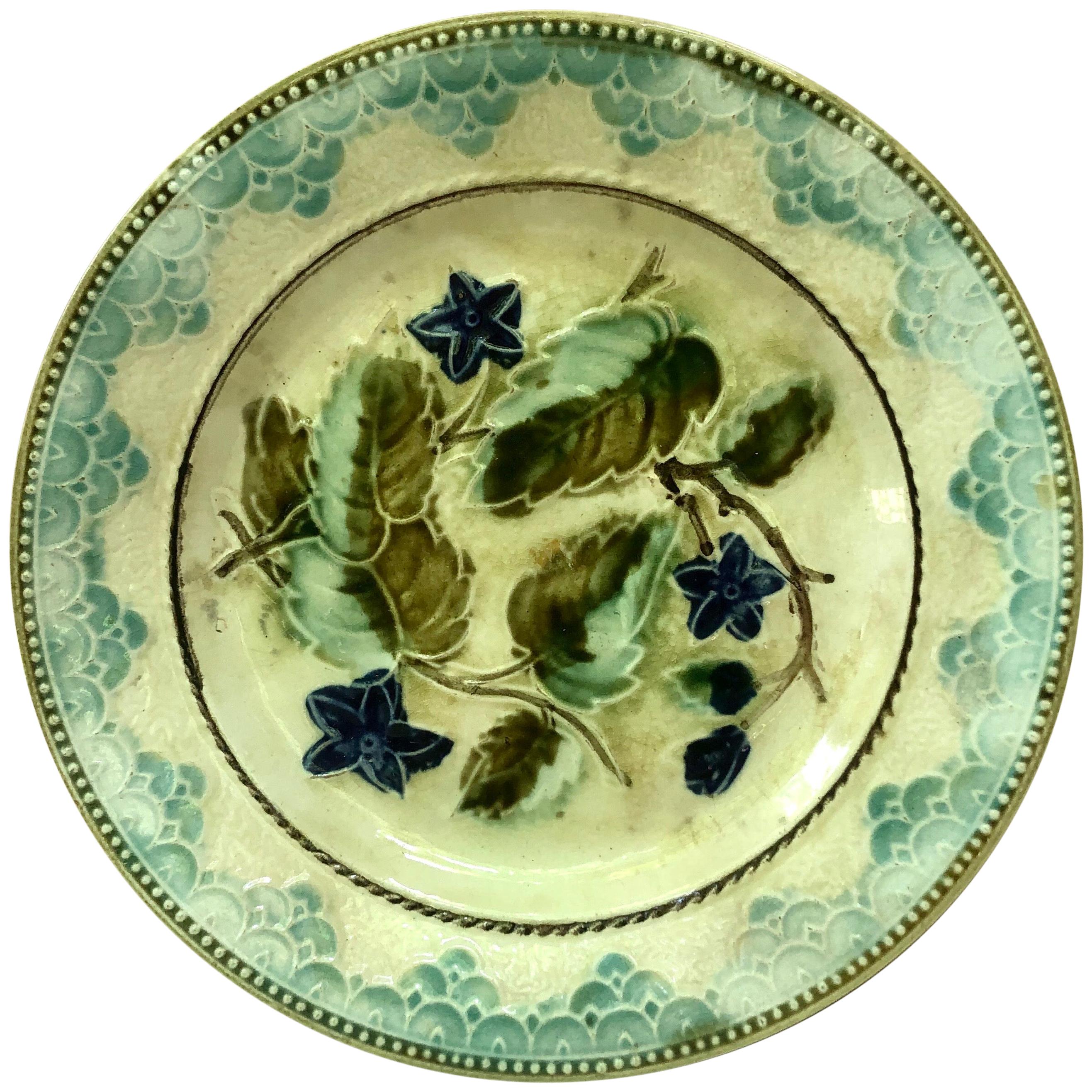 Majolica plate with blue flowers and leaves, circa 1890 attributed to Onnaing.