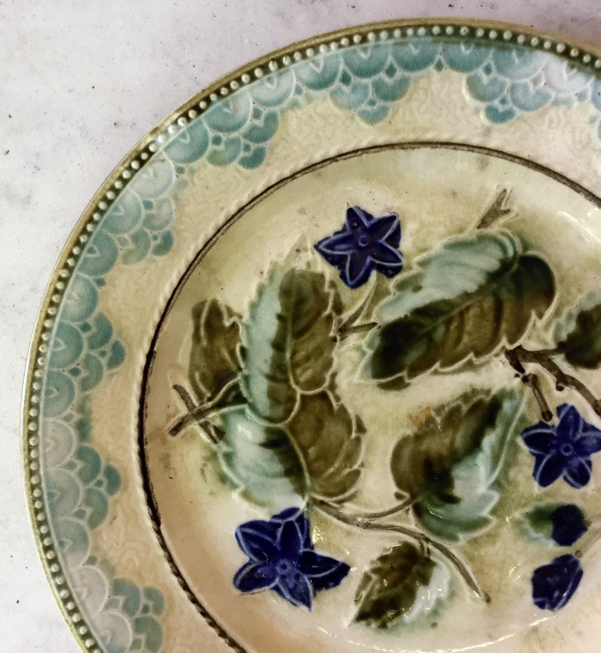 Majolica plate with blue flowers and leaves circa 1890 attributed to Onnaing.