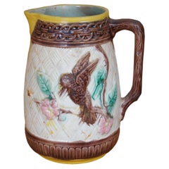Antica brocca in maiolica Parrot Bird Dogwood Flower Basketweave 7"
