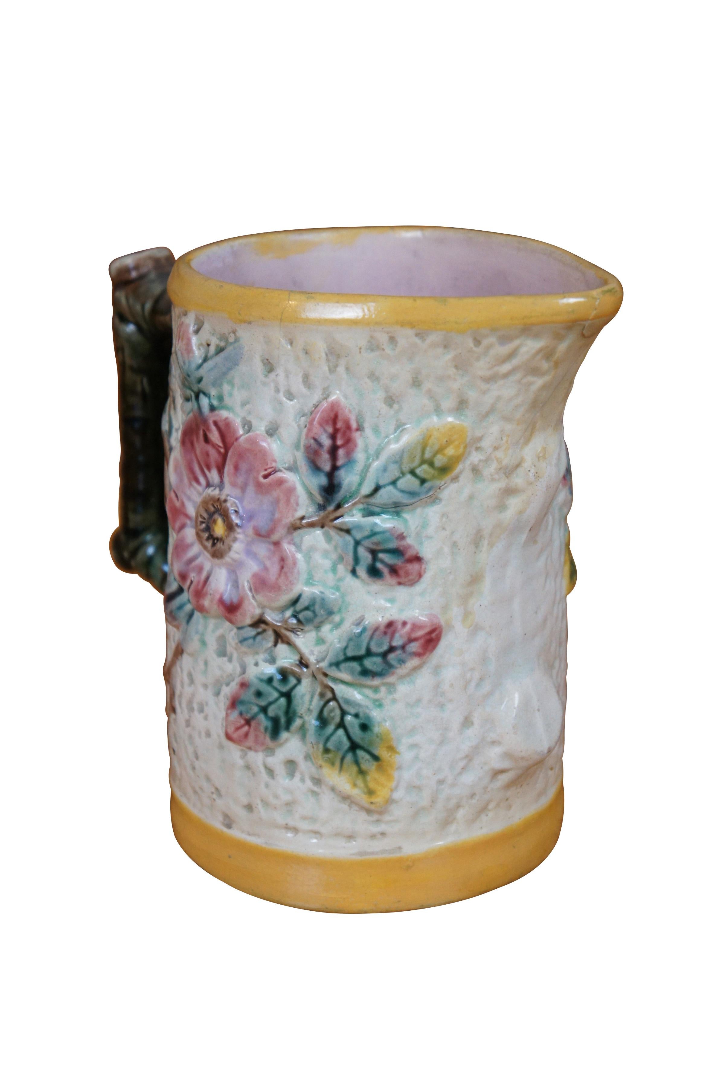 Antique Shorter & Boulton Majolica creamer pitcher / jug featuring a rustic tree bark motif with wild rose flowers and branch handle.   

Dimensions:
7