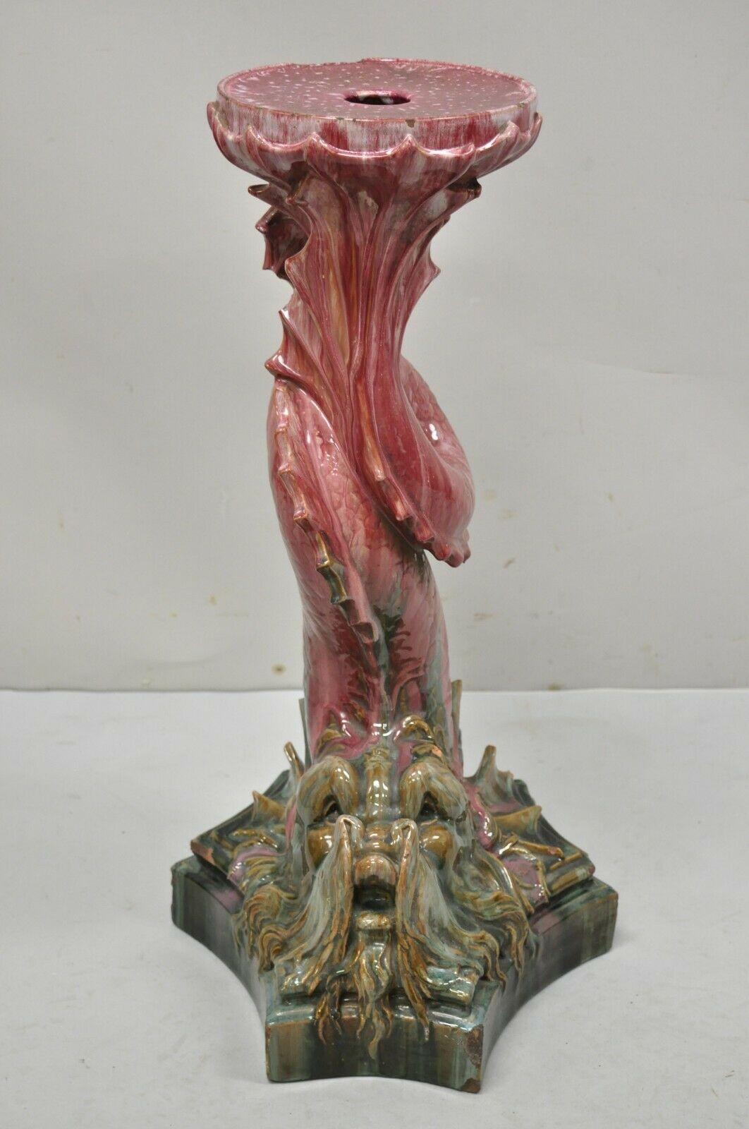 Antique Majolica Terracotta Pottery Dolphin Fish Serpent pink plant stand pedestal. Item features a unique bearded serpent form, glazed terracotta construction, beautiful pink and green color, very nice antique item, great style and form. Circa 19th