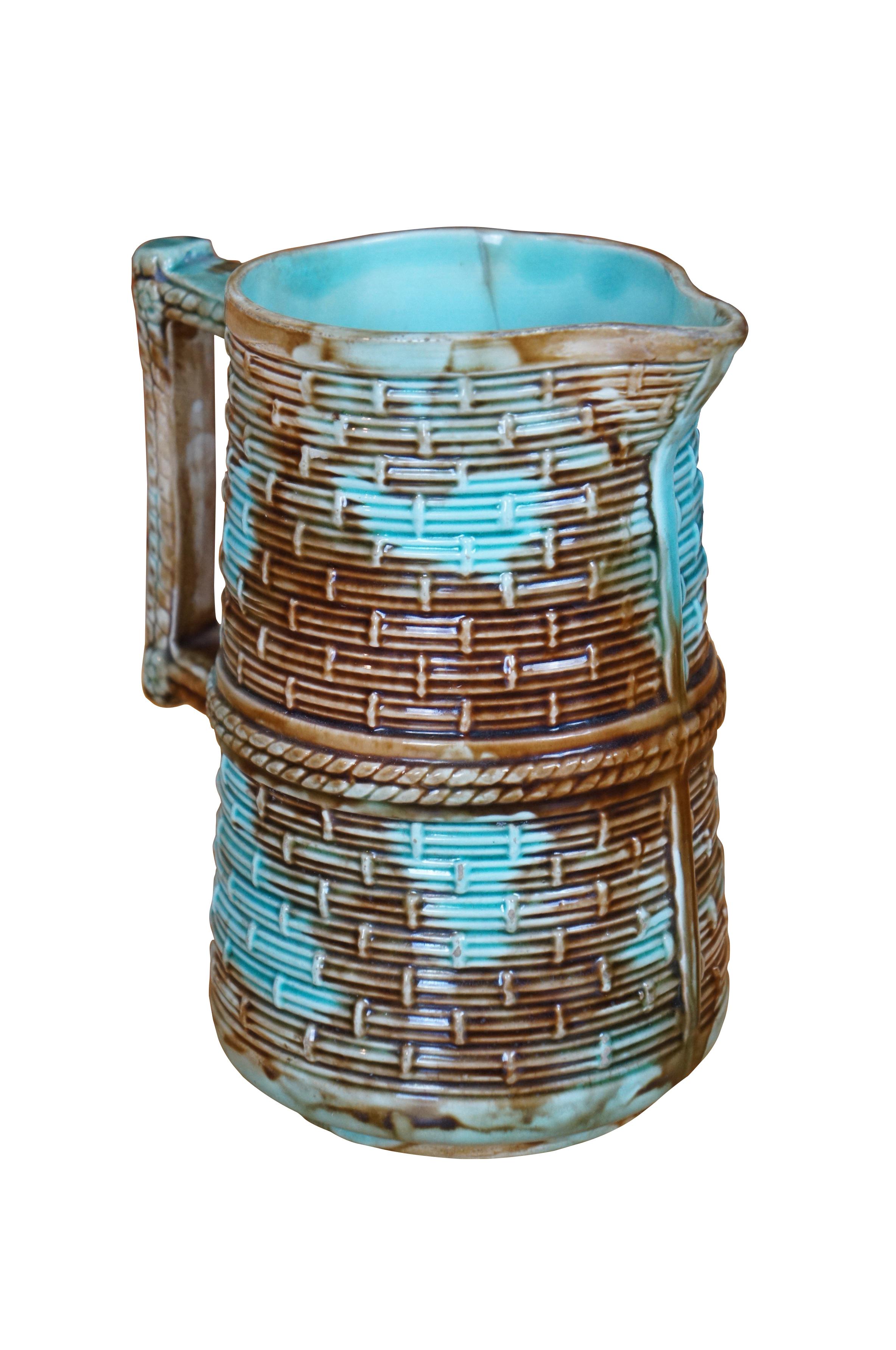 Antique Majolica basketweave creamer pitcher or jug featuring a woven basket design in Southwestern turquoise blue and mottled brown.

Dimensions:
5