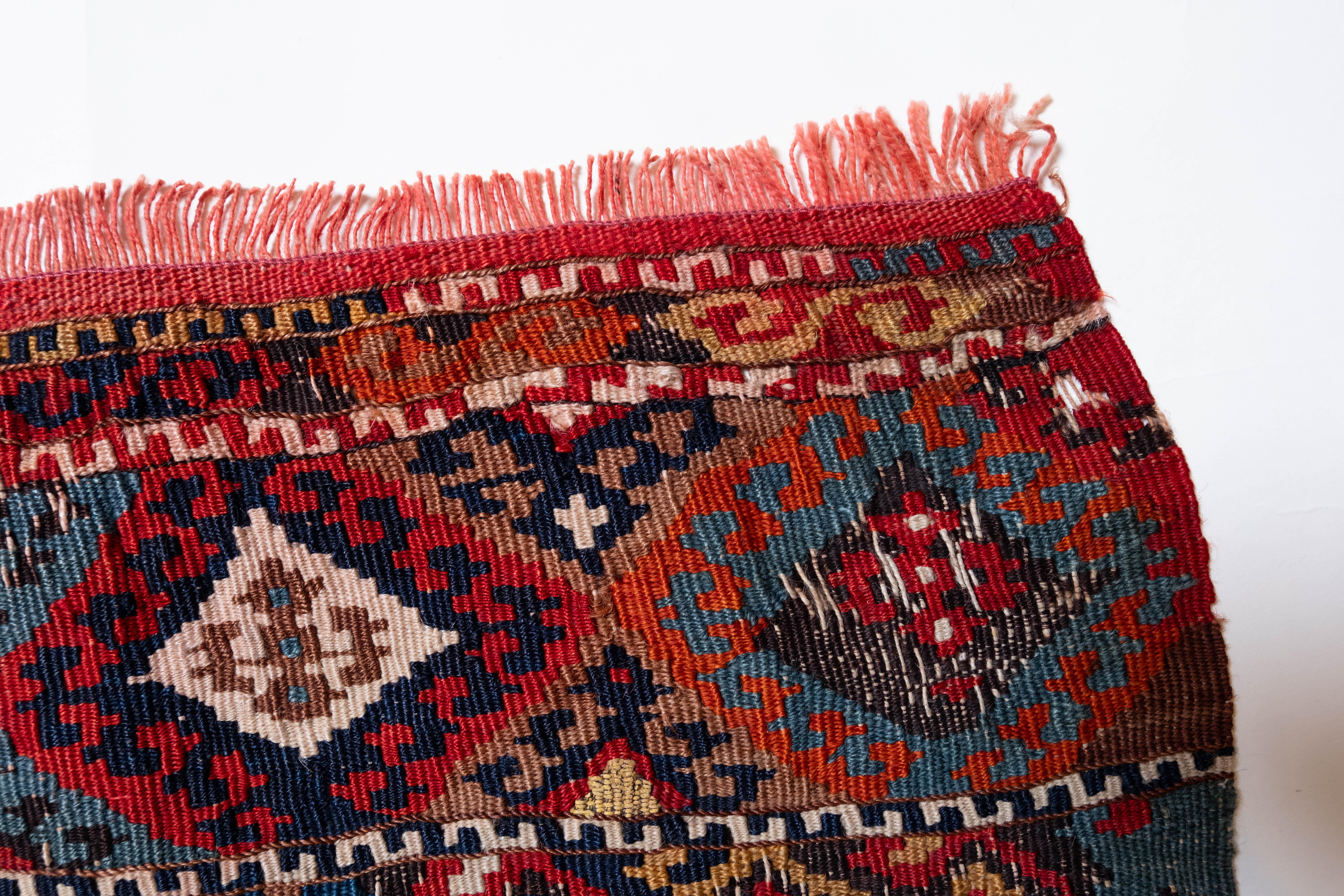 This is Eastern Anatolian Antique Heibe Heybe Kilim from the Malatya region with metallic threads and a rare, beautiful color composition.

This highly collectible antique kilim has wonderful special colors and textures that are typical of an old