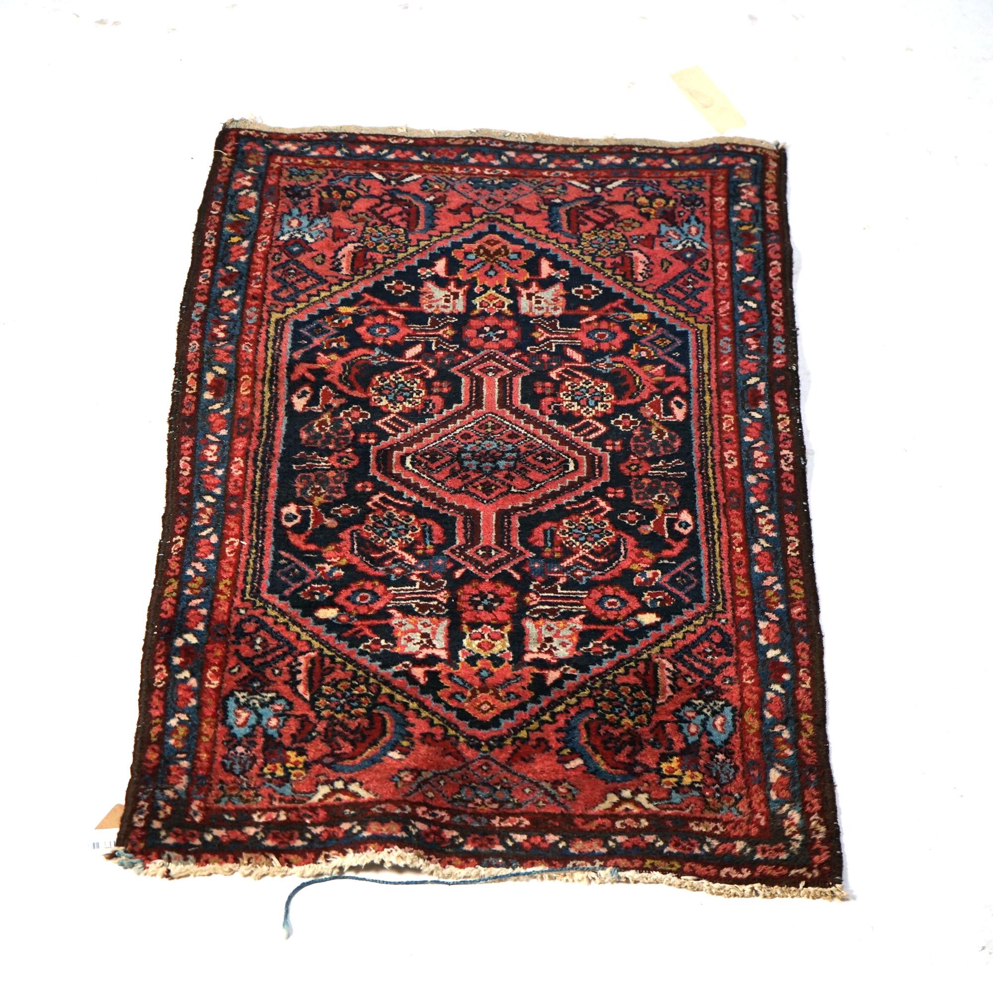 An antique Malayar oriental throw rug offers wool construction with central medallion and stylized foliate elements, c1920

Measures - 48