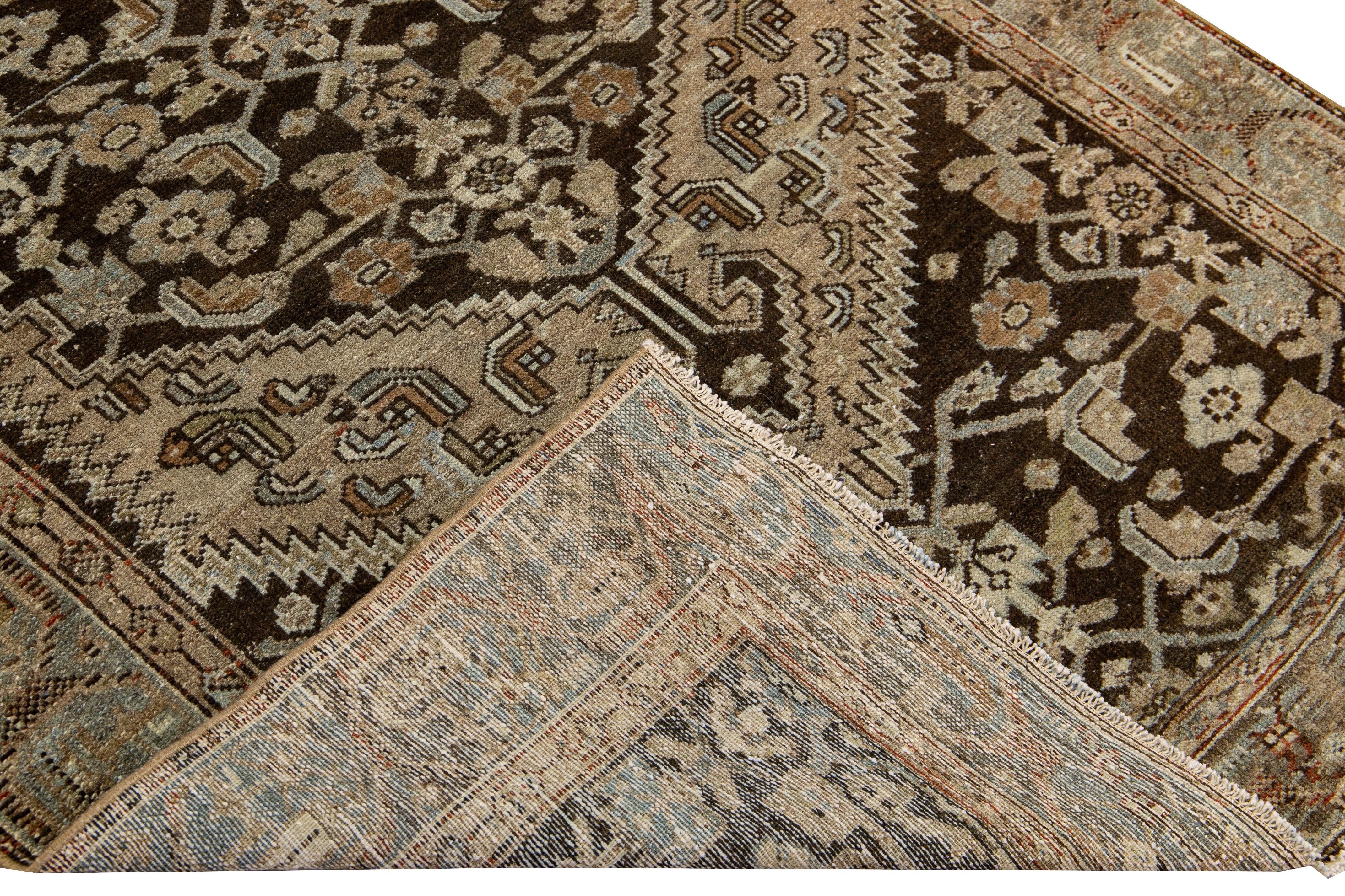Beautiful antique Malayer hand-knotted wool rug with a brown field. This Malayer piece has a blue and beige accent in a gorgeous all-over geometric floral design.

This rug measures: 3'10
