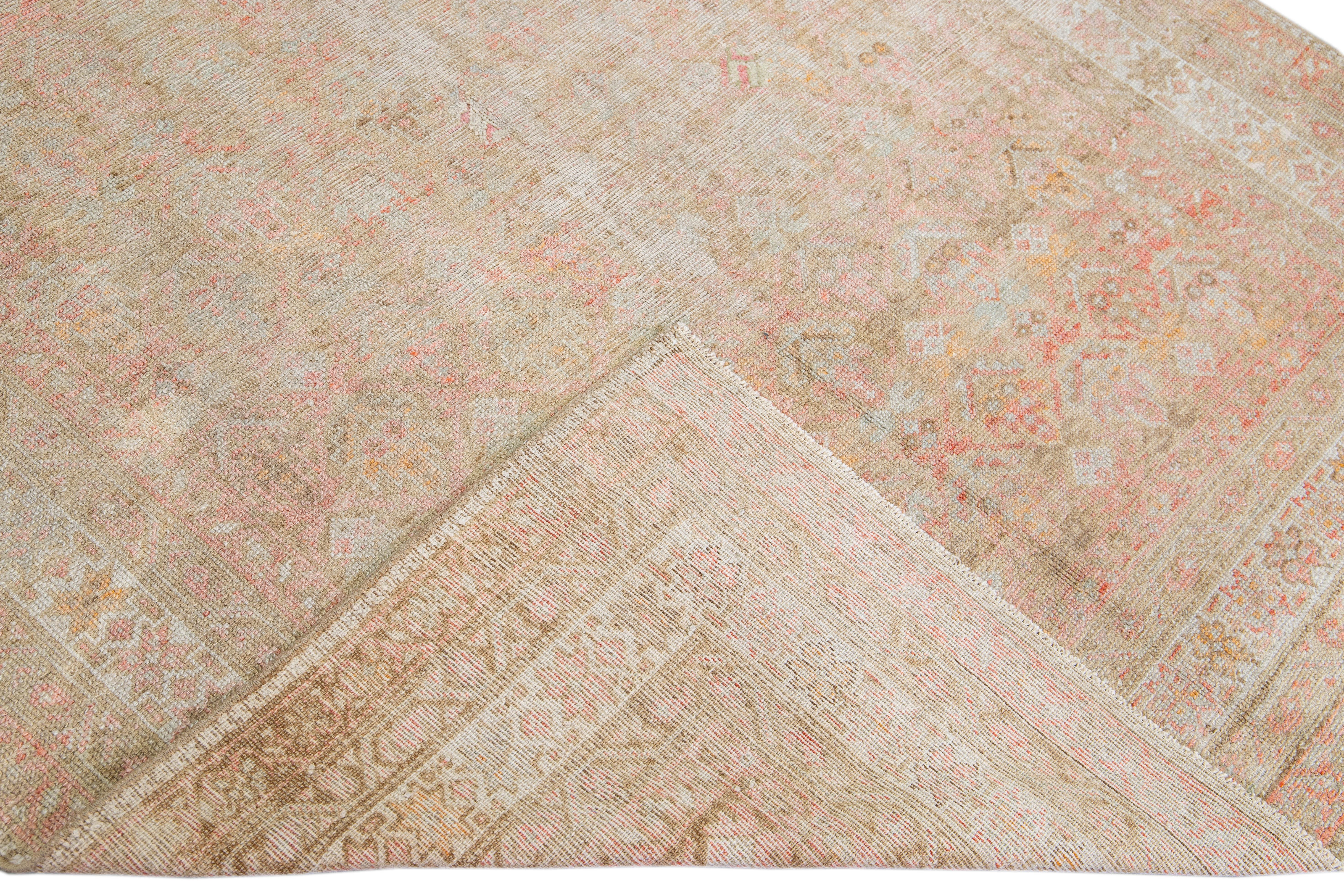 Beautiful antique Malayer hand-knotted wool rug with a pink field. This Malayer piece has a tan accent in a gorgeous all-over geometric floral pattern design.

This rug measures: 5' x 10'.

Our rugs are professional cleaning before shipping.

 