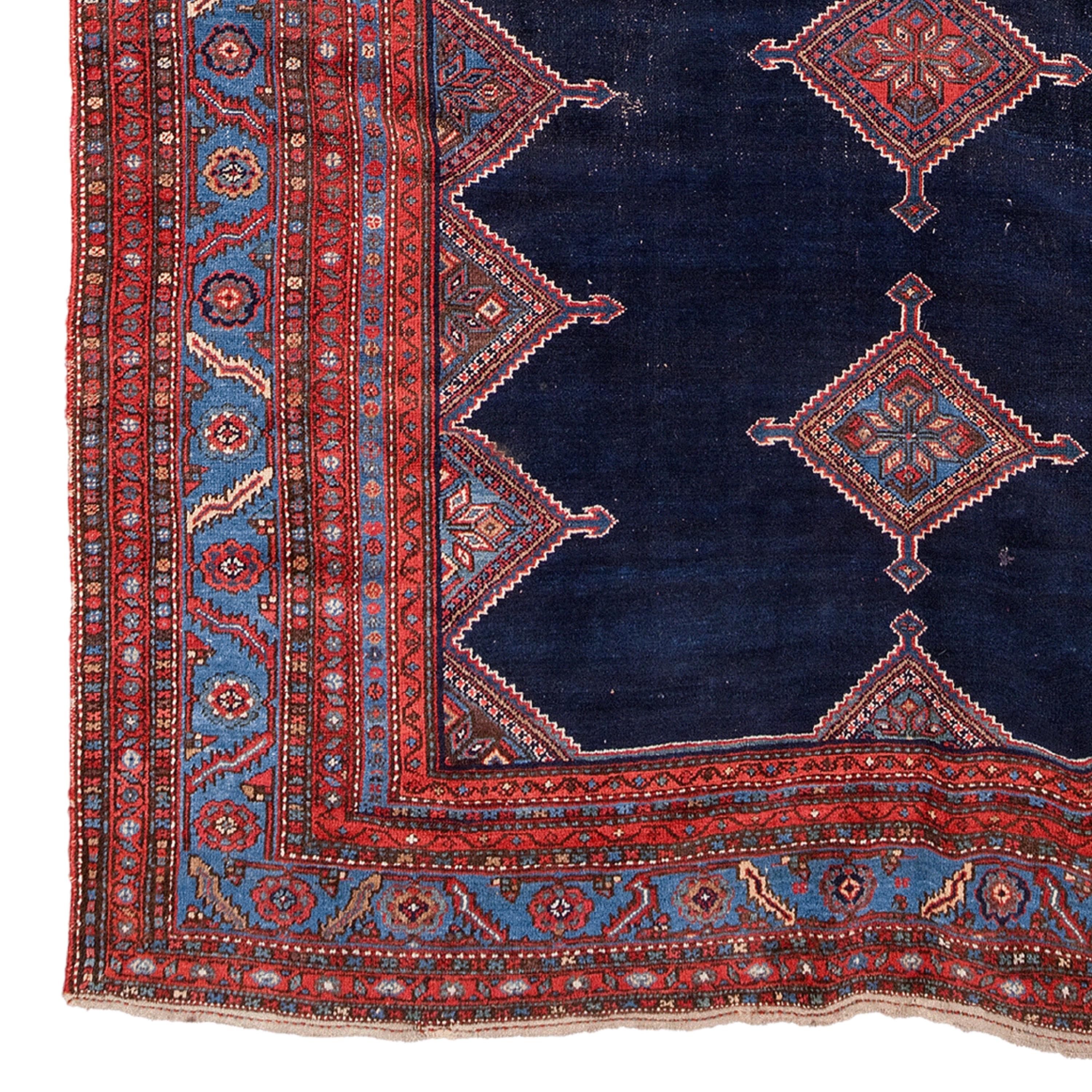 19th Century Malayer Rug, Vintage Rug

This extraordinary carpet will fascinate you with its intricate designs and vibrant colors that reflect the rich history and craftsmanship of the period. Each stitch tells the story of skilled craftsmen who