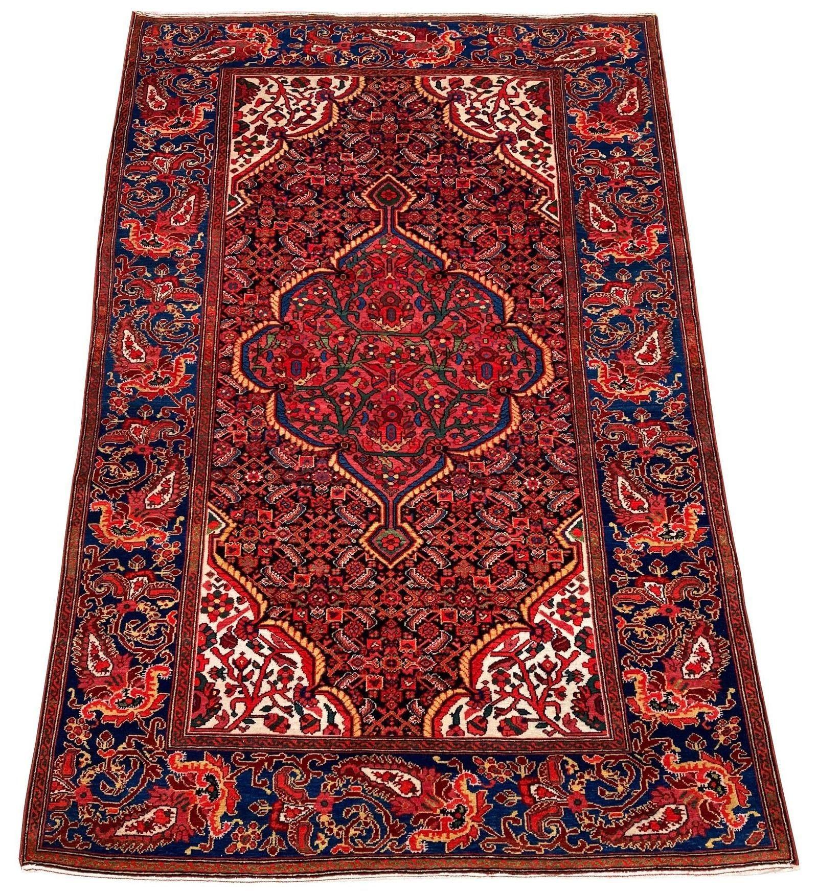 An exceptional antique Malayer rug, handwoven circa 1900 with a floral medallion on a navy blue Herati design field and particularly attractive mid blue border. This rug is in outstanding condition with a very fine weave, fabulous wool quality and