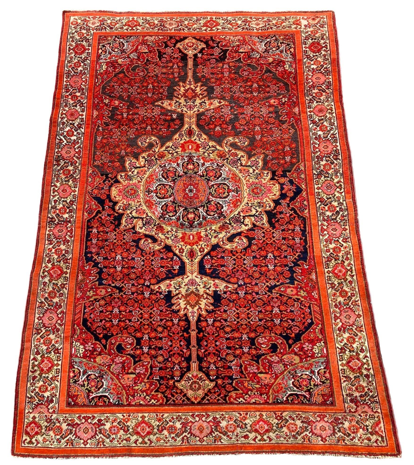 A fabulous antique Malayer rug, handwoven circa 1900 with an intricate floral medallion on a rich, abrasched indigo field and attractive ivory border. Finely woven with lovely wool quality and great colours.
Size: 2.06m x 1.40m (6ft 9in x 4ft