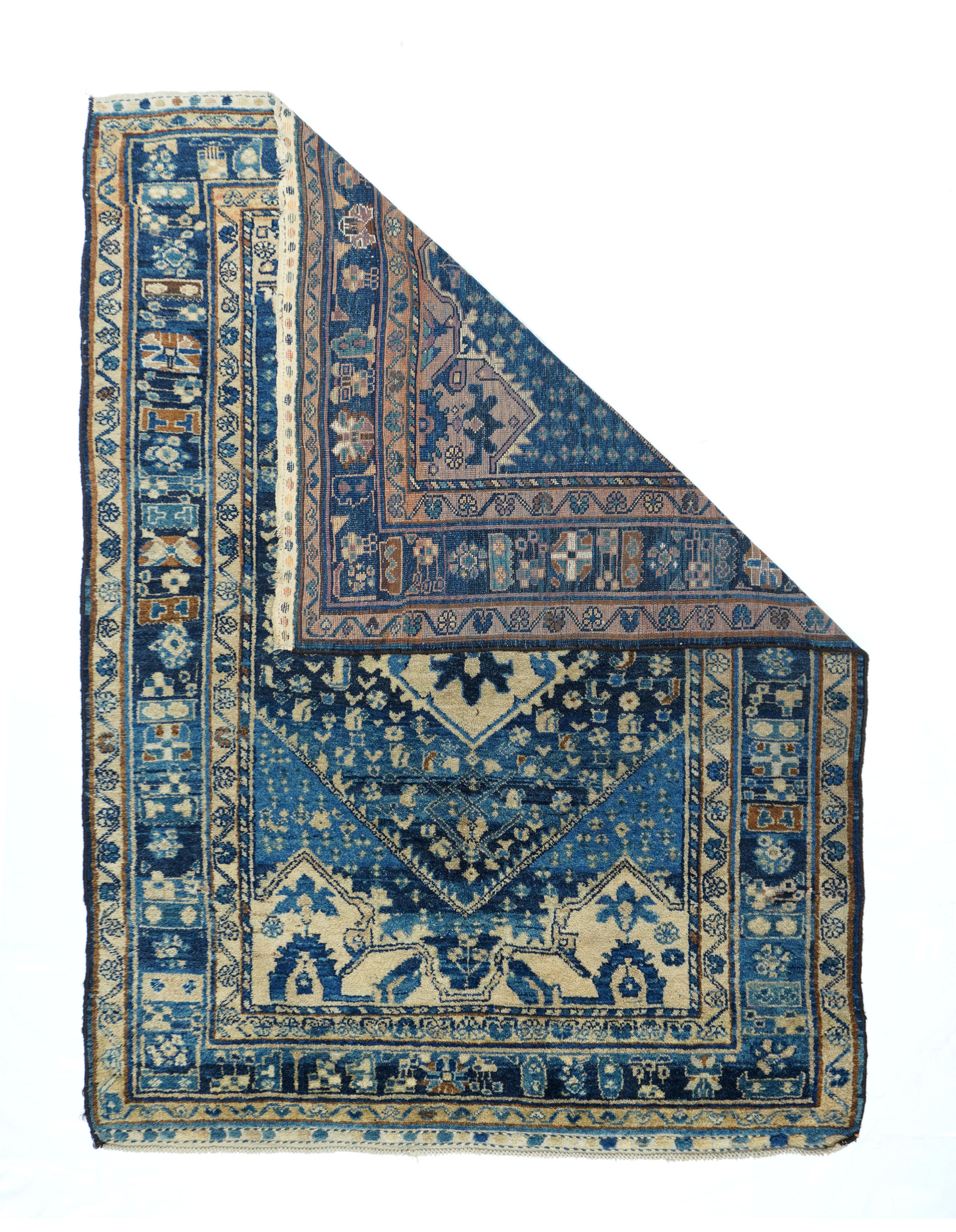 Antique Malayer rug 5'4'' x 7'6''. Abrashed dark to royal blue deep, conjoint corners display a scatter of small divided lozenge3s, with presenting a dark blue hexagonal field decorated with a semi-Herati scatter and accented by an irregular straw