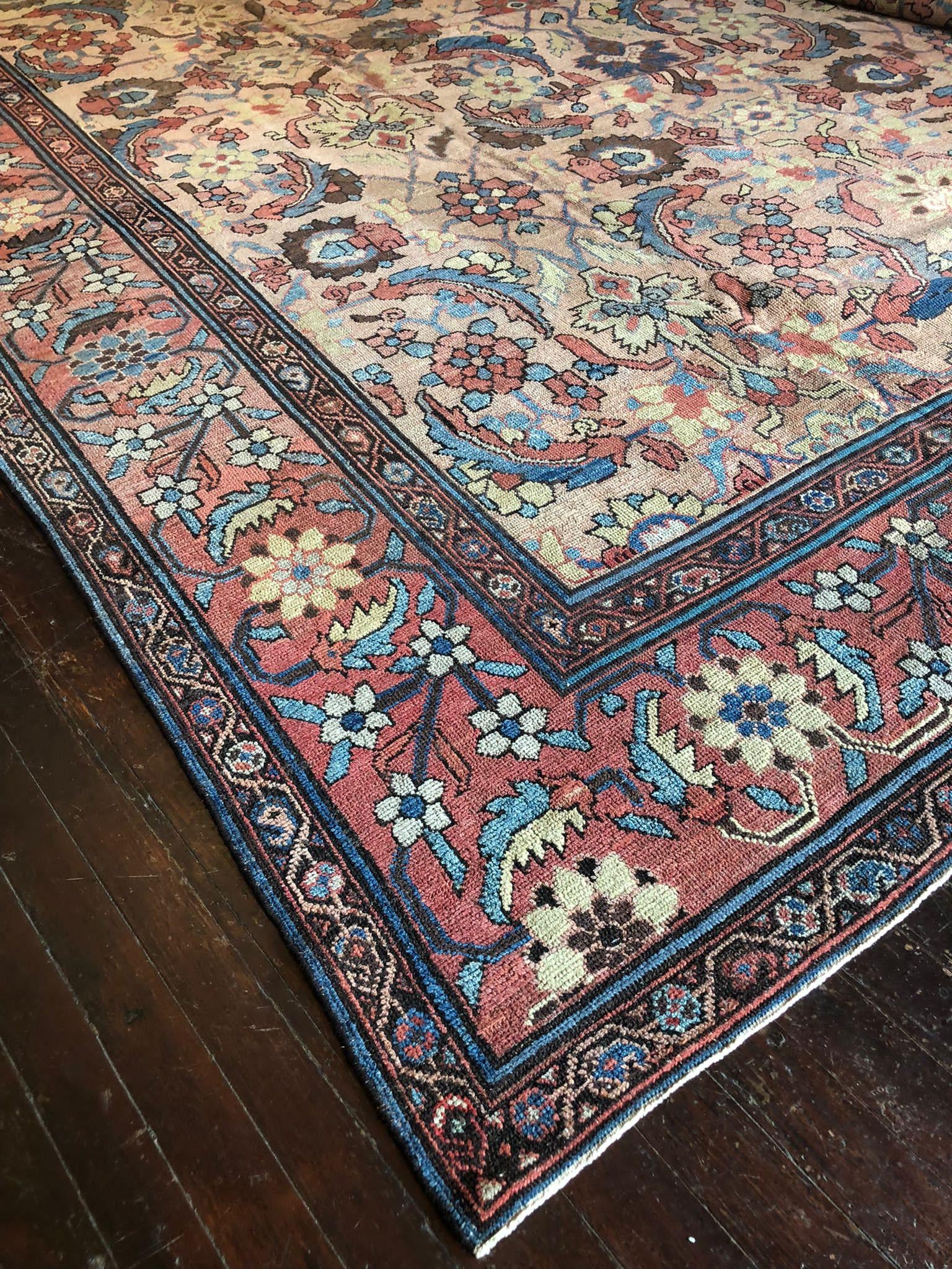 An Antique Malayer Rug is a true treasure of Persian craftsmanship, celebrated for its timeless beauty and intricate designs. This particular rug, with its generous dimensions of 12 feet 2 inches by 16 feet, is a magnificent example of the artistry