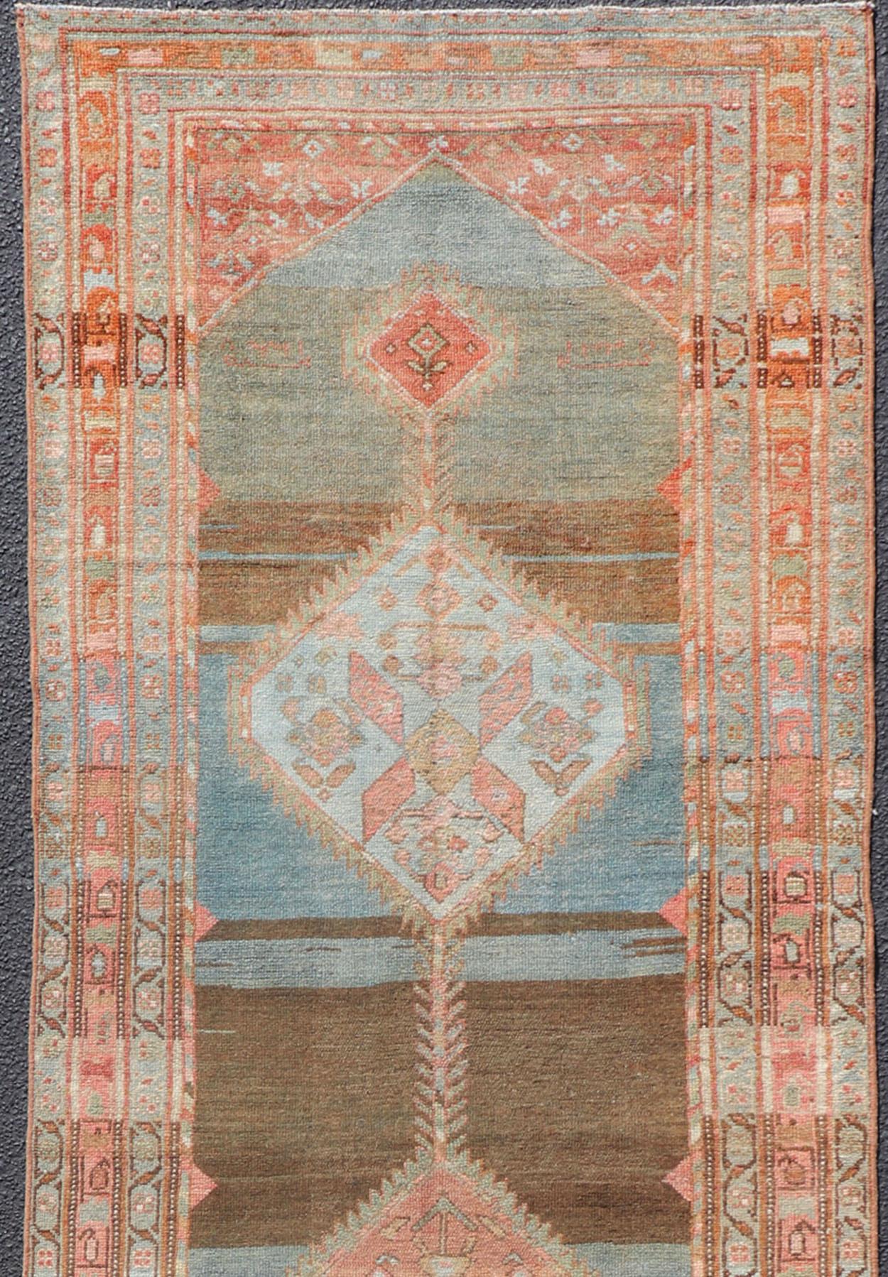 Geometric medallion design Persian Malayer runner with charcoal, gray, blue, red and orange colors, rug EN-2344, country of origin / type: Iran / Malayer, circa 1910

This long antique Persian Malayer runner, circa 1910s, is an intricate and