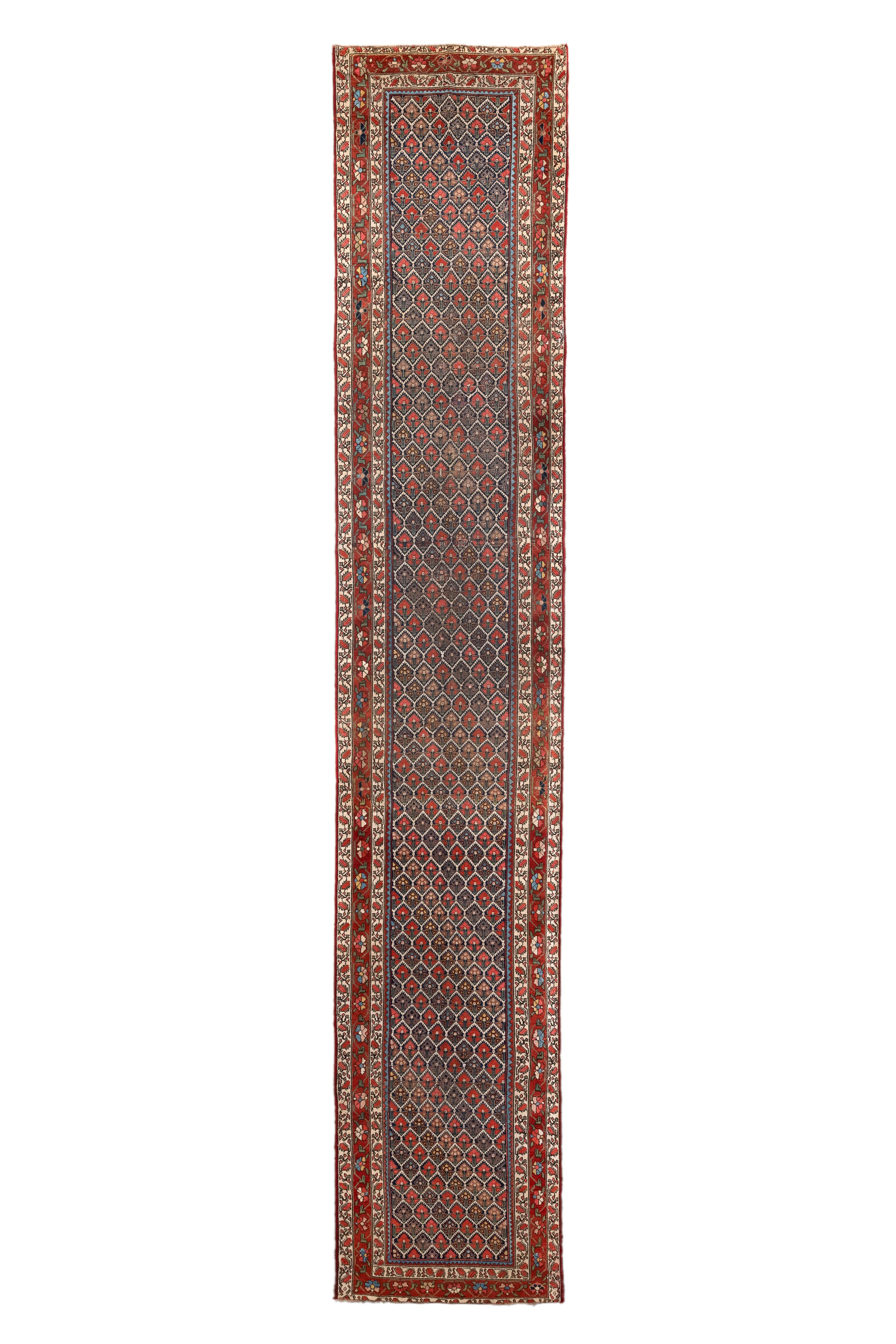 Das satte dunkelblaue Feld ist durch ein elfenbeinfarbenes halbsägezahnförmiges Sechseckgitter strukturiert, mit diagonalen einheitlichen  mit Blumen. Rot, strohfarben, azurblau und fast schwarz akzentuieren die Blüten. Die Blumen bestehen im Grunde