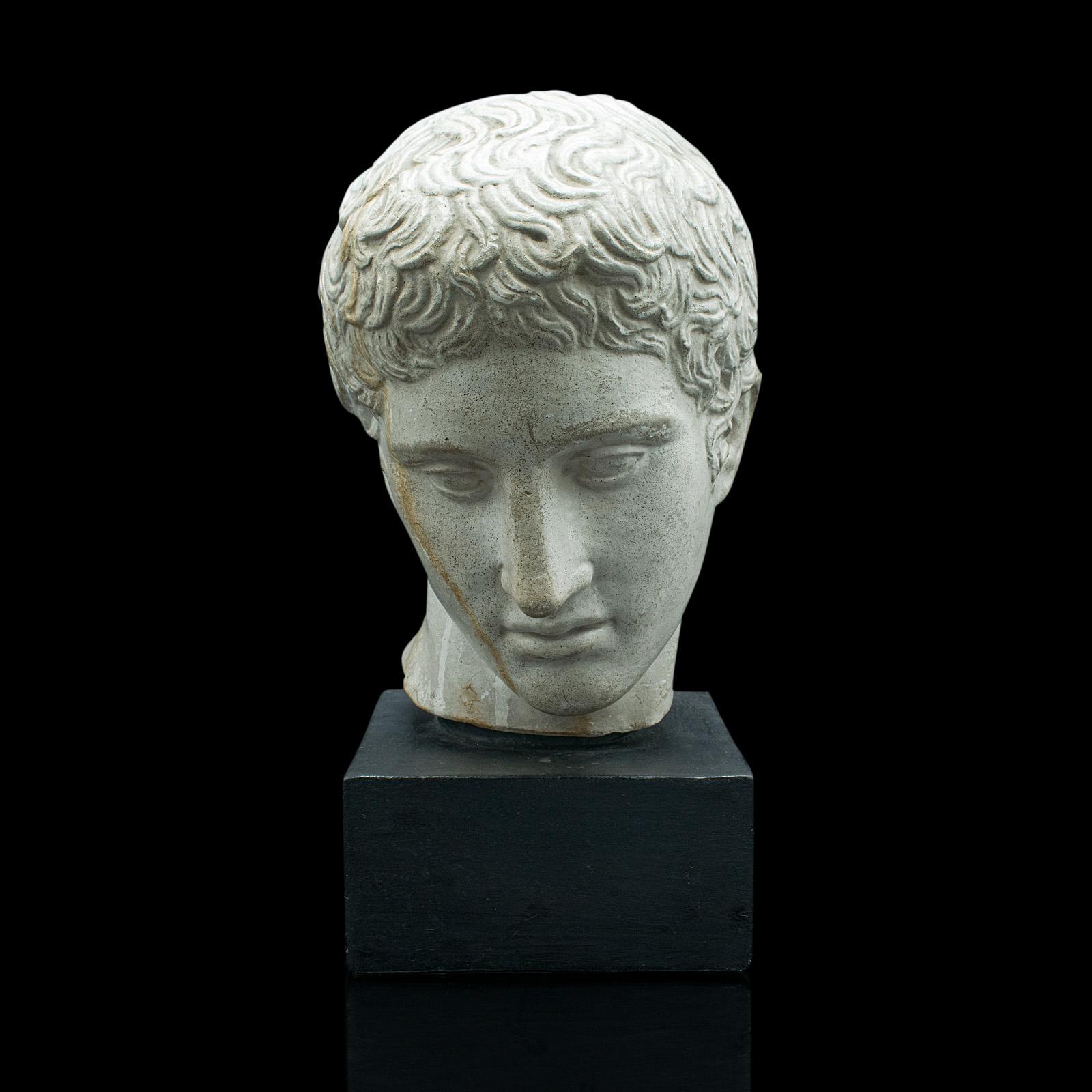 This is an antique male portrait bust. An Italian, plaster figure after Doryphorus by Polykleitos, dating to the late Victorian period, circa 1900.

A classic Roman sculpture, the Doryphorus or Spear-bearer is a later copy of the original bronze by