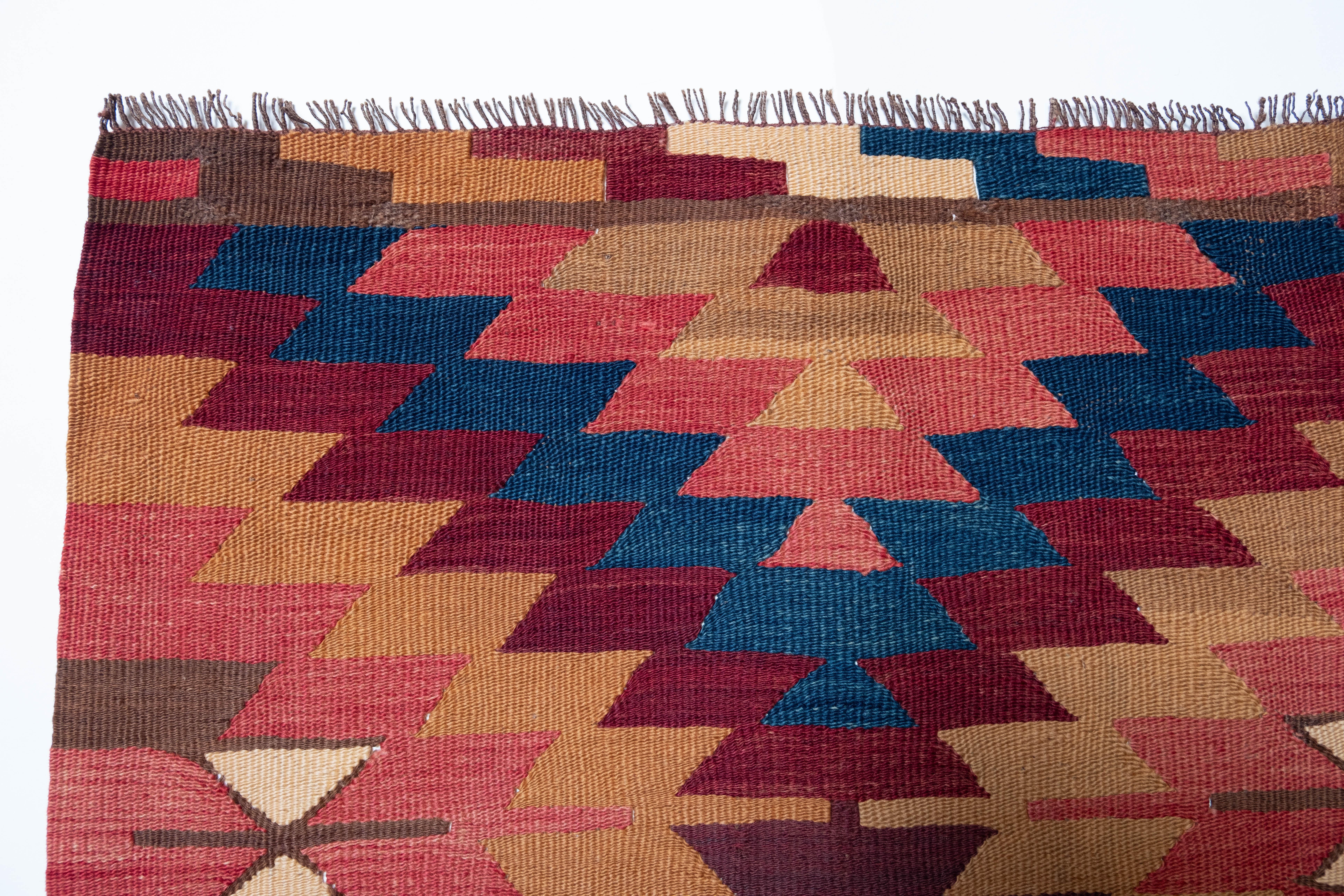 This is Northwest Anatolian Antique Kilim from the Manastir region with a rare and beautiful color composition.

This kilim is chic and natural yet has the most beautiful combination of vibrant dyed colors. Each dyed color is deep and calm, yet