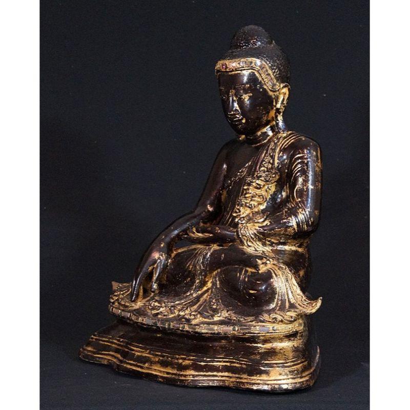 Material: bronze
43,5 cm high 
37 cm wide
Weight: 12.25 kgs
Gilded with 24 krt. gold
Mandalay style
Bhumisparsha mudra
Originating from Burma
19th century - Mandalay period
With porcelain eyes

