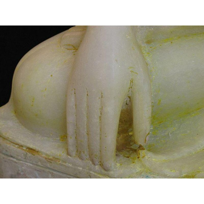 Material: marble
Measures: 58 cm high 
Weight: 36.05 kgs
Mandalay style
Bhumisparsha mudra
Originating from Burma
19th century.

