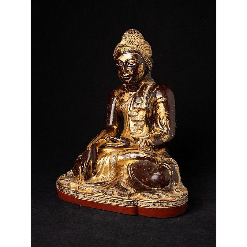 This antique wooden Buddha statue is a truly unique and special collectible piece. Standing at 39 cm high, 31 cm wide, and 23.5 cm deep, it is made of wood and it has been gilded with 24 krt gold leaf, adding to its beauty and value. The intricate