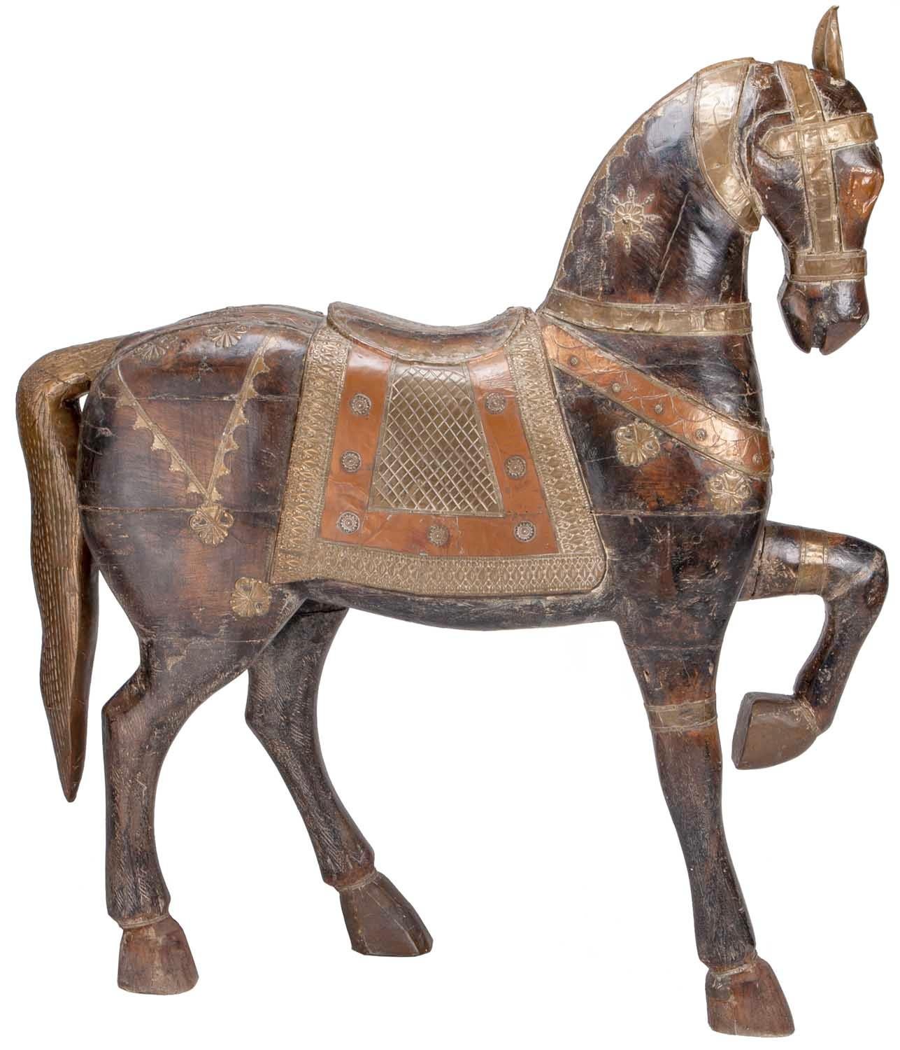 Hand carved wooden horse with brass and copper inlays.
Purchased in India, November 2019.
 