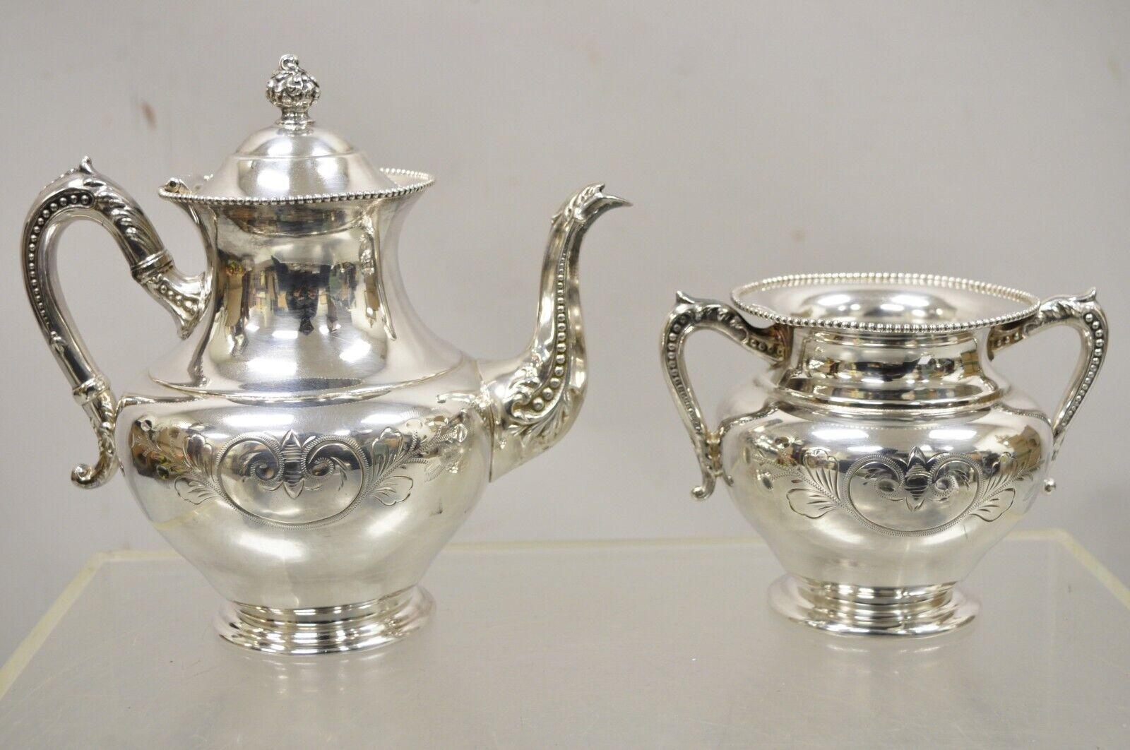 Antique Manhattan silver plate co silver plated tea serving set - 4pc set. Item features (1) Tea pot, (1) covered sugar bowl, (1) creamer, (1) open sugar bowl, fancy scrolling etch work throughout, original stamp, very nice antique set. Circa Early